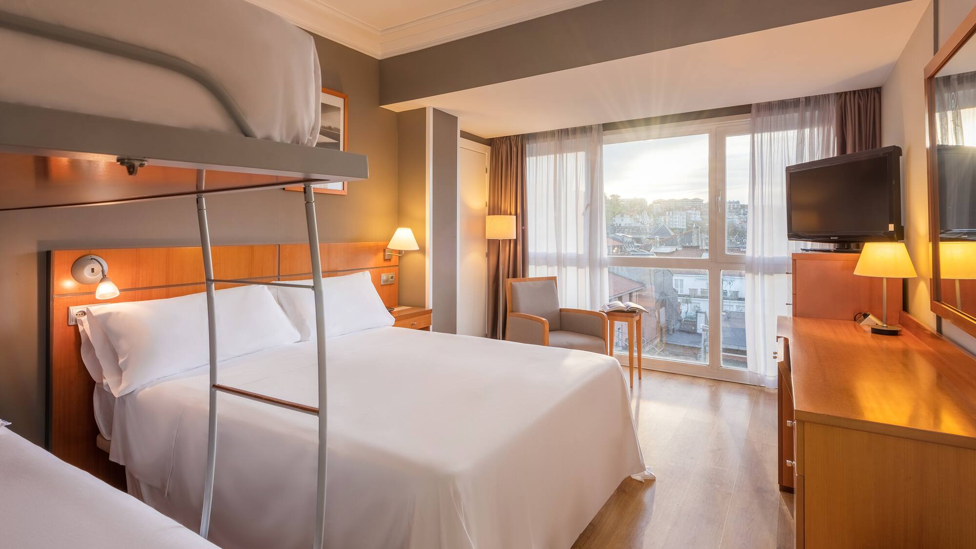 a room with bunk beds and a television