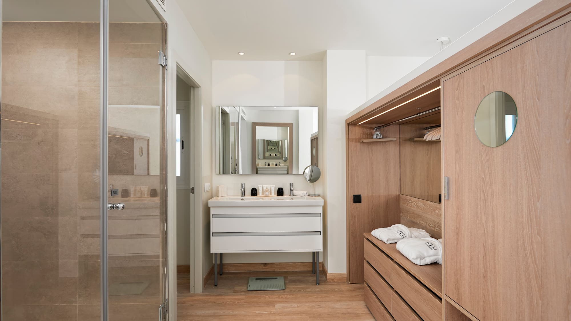 a bathroom with a mirror and a closet