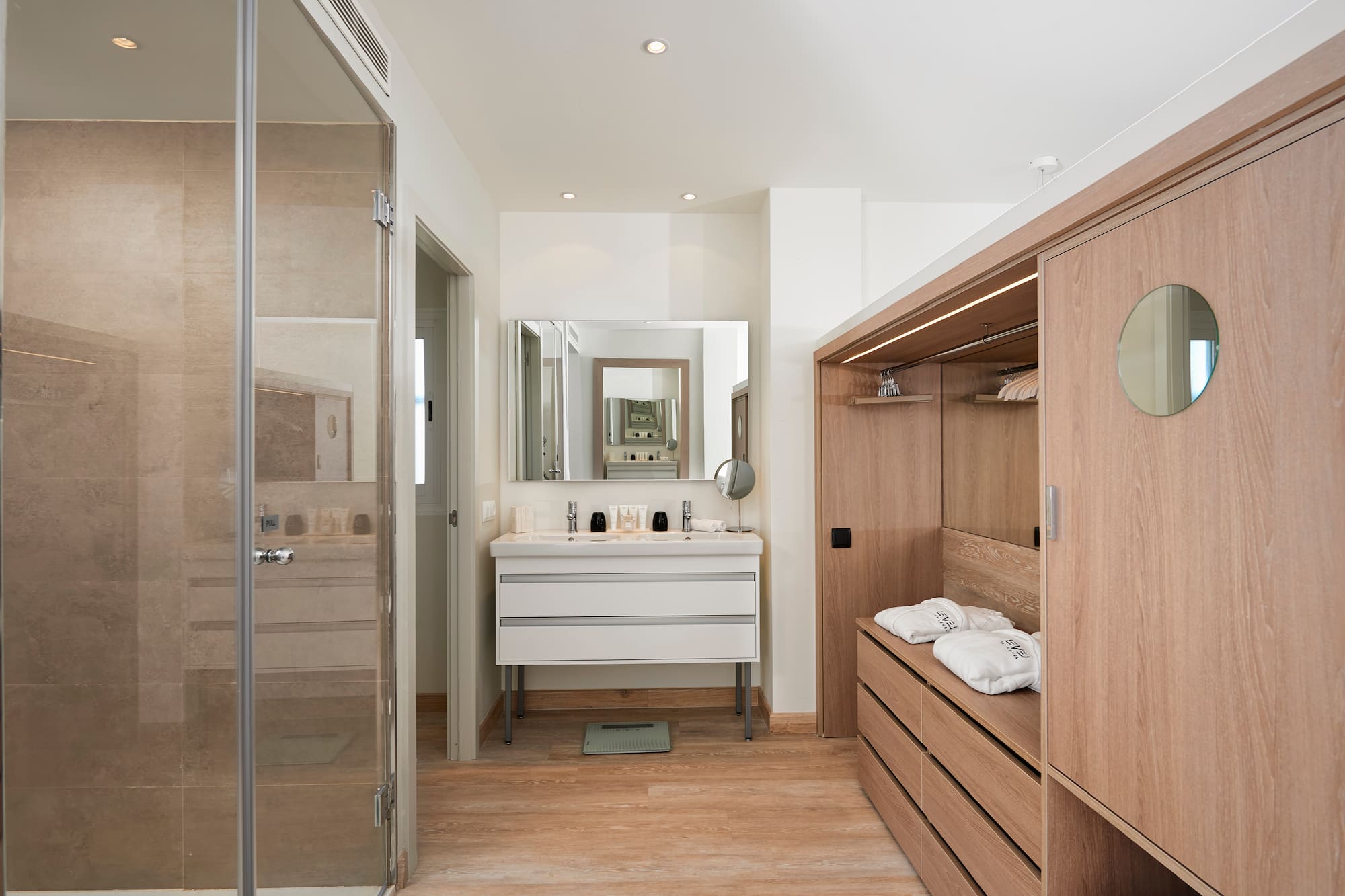 a bathroom with a mirror and a closet