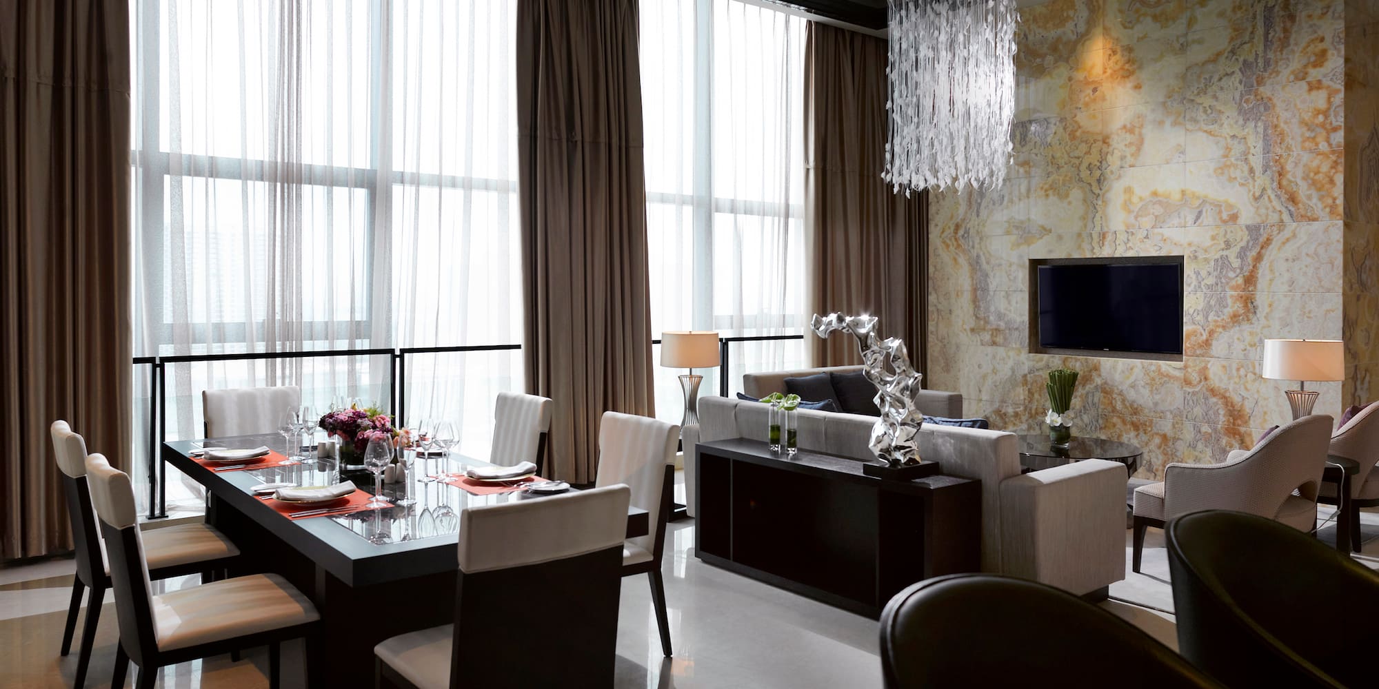 a living room with a table and chairs