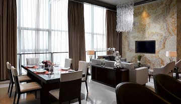 a living room with a table and chairs