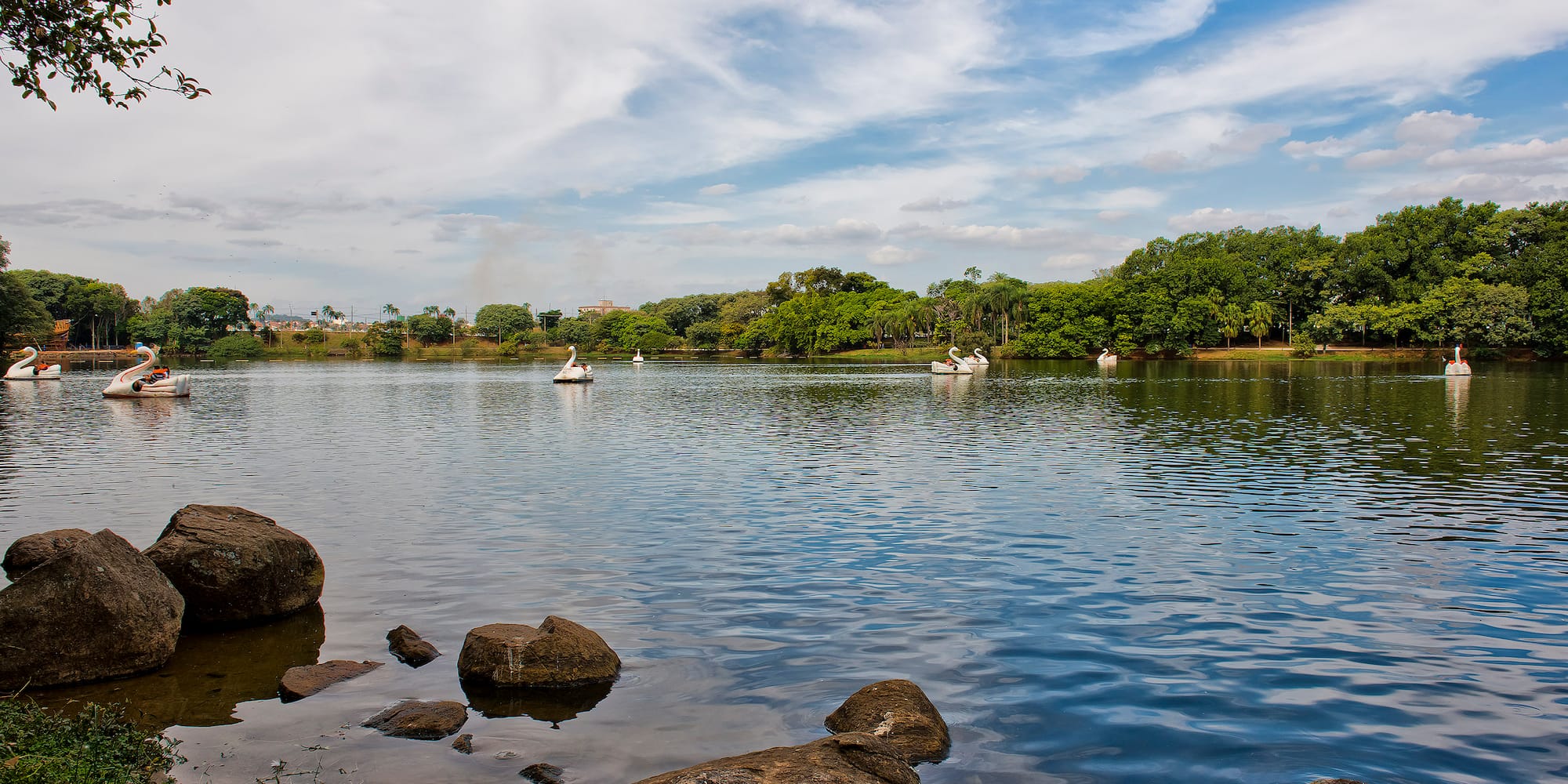 a group of people in boats on a lake