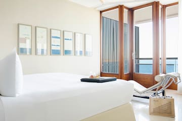 a room with a bed and a chair