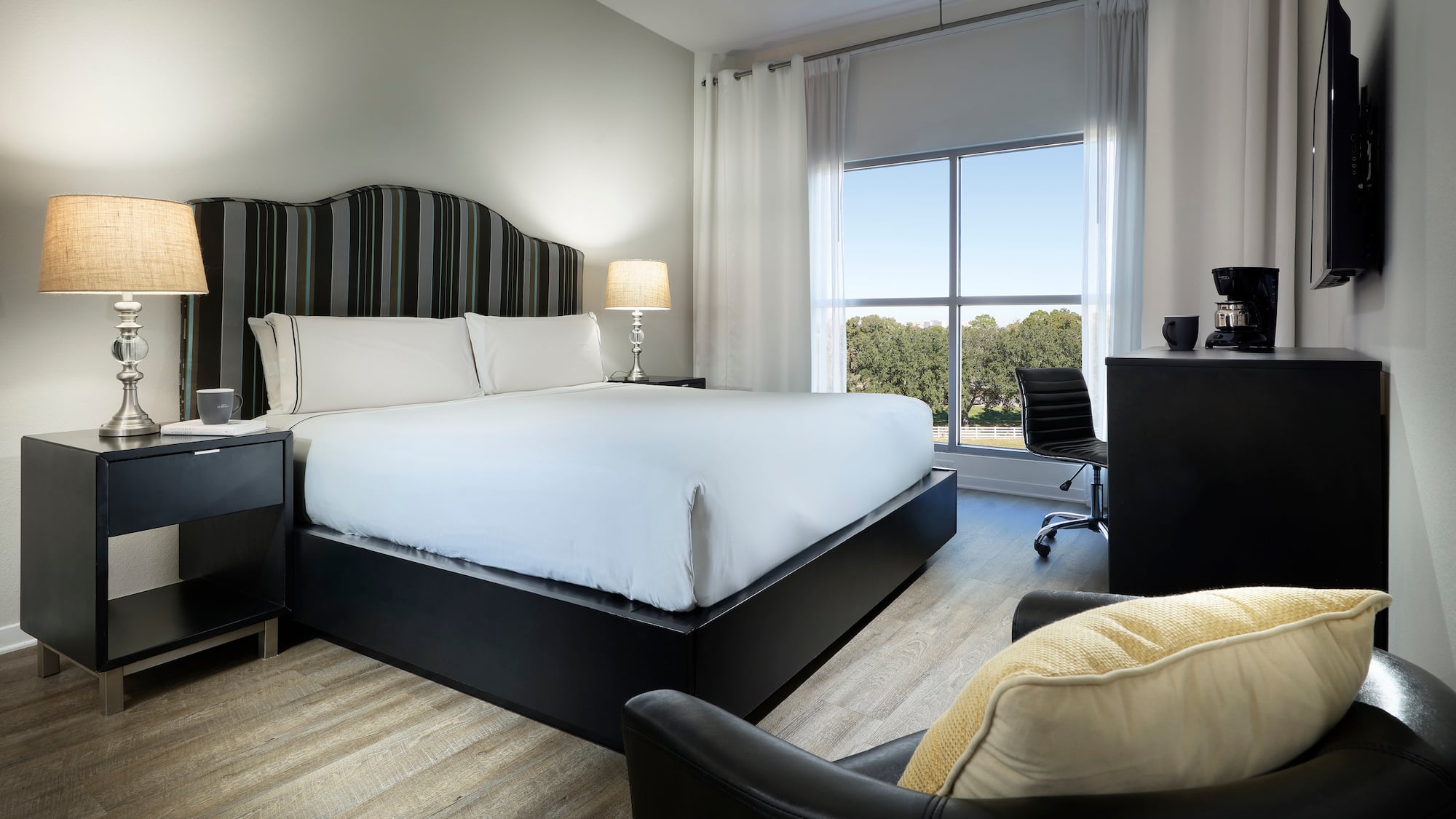 a room with a bed and a chair