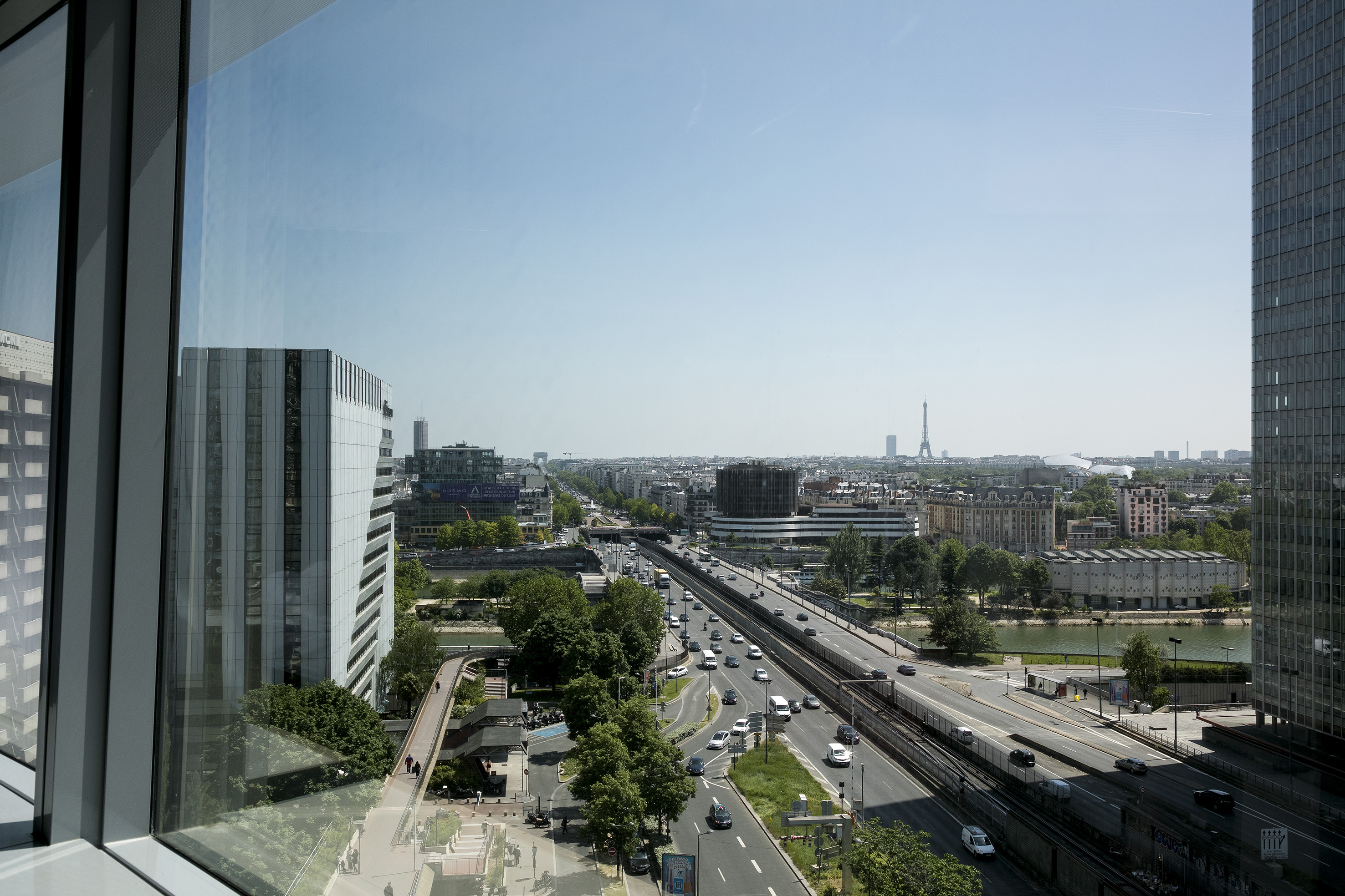 Paris city view with highway, Seine River, Eiffel Tower and Arc de Triomphe.