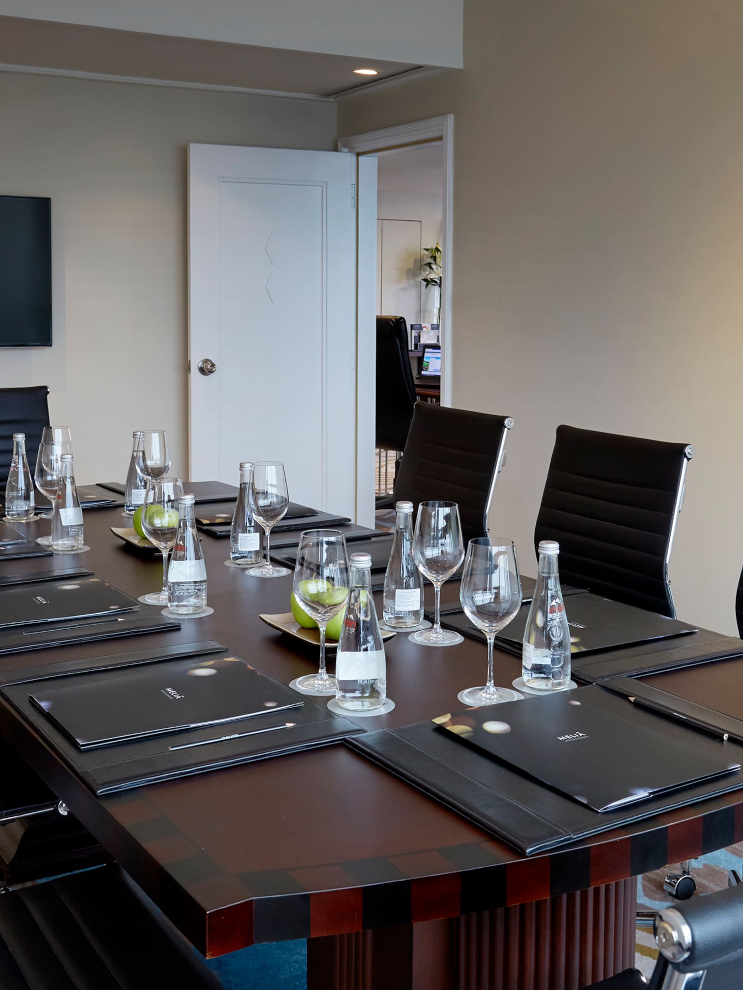 a table with glasses and water on it