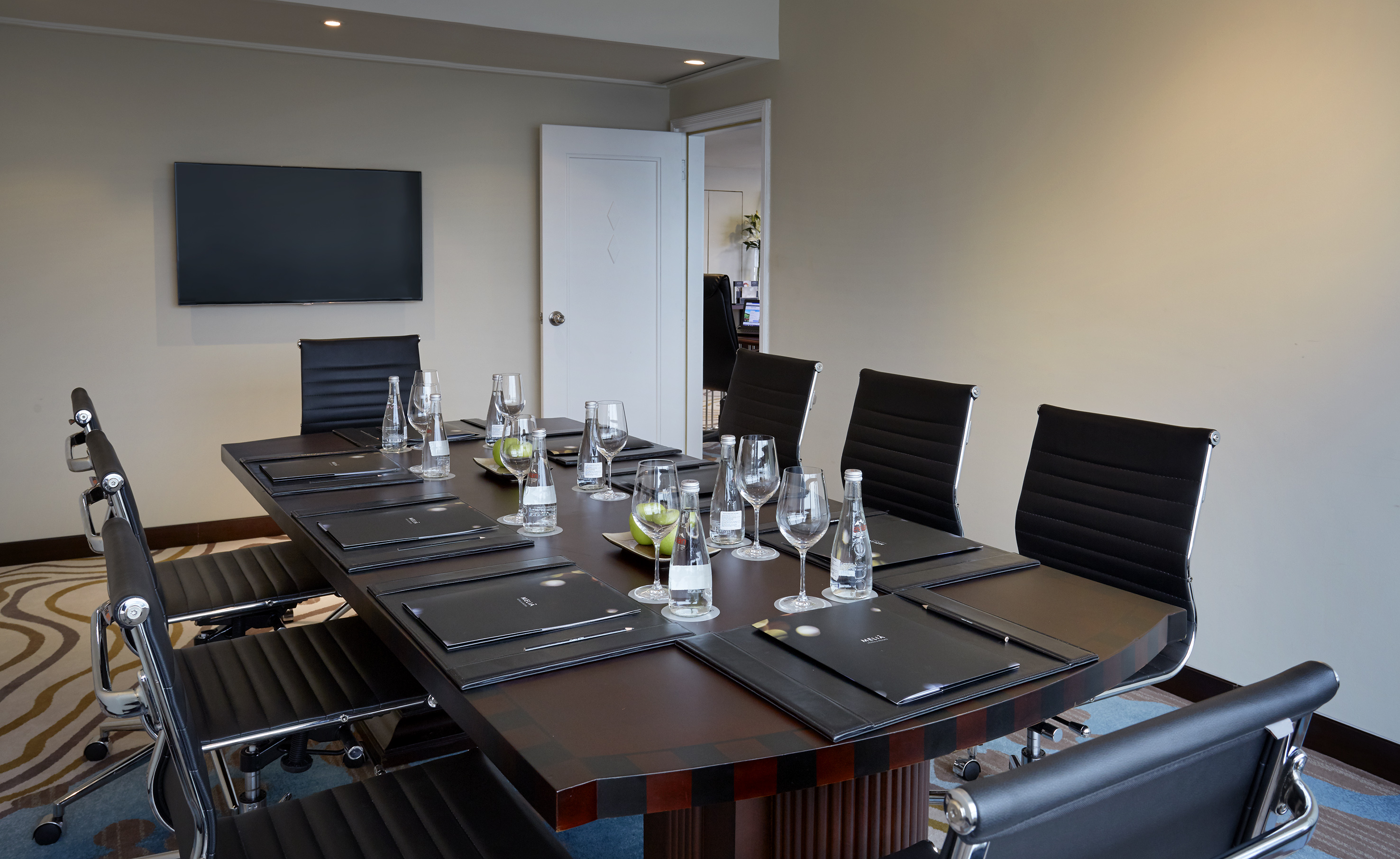 a table with glasses and water on it