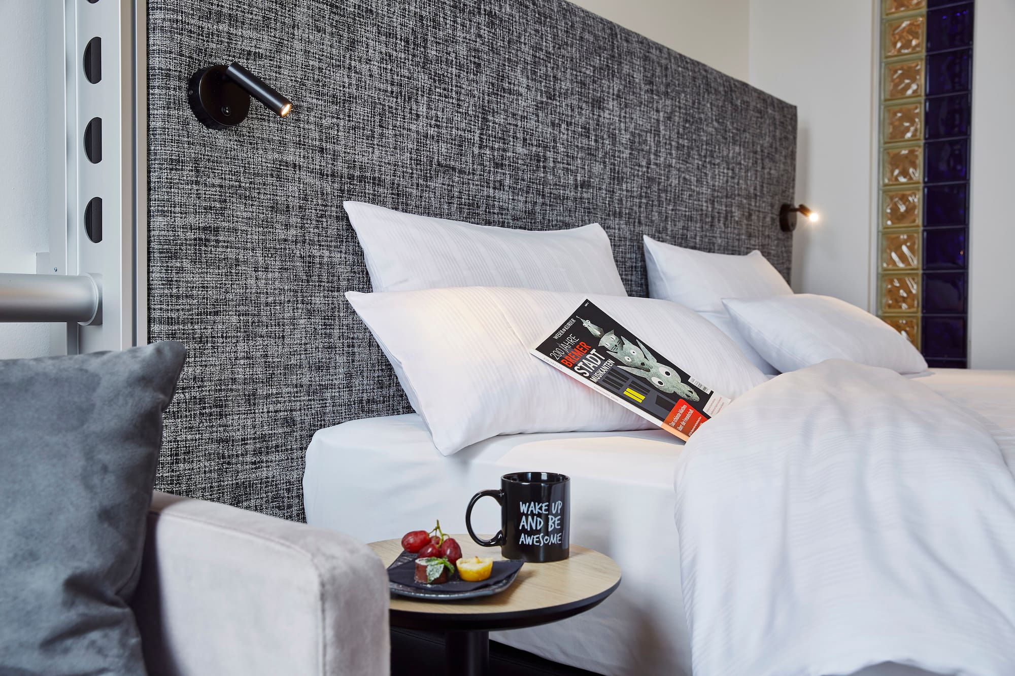 a bed with pillows and a book on it