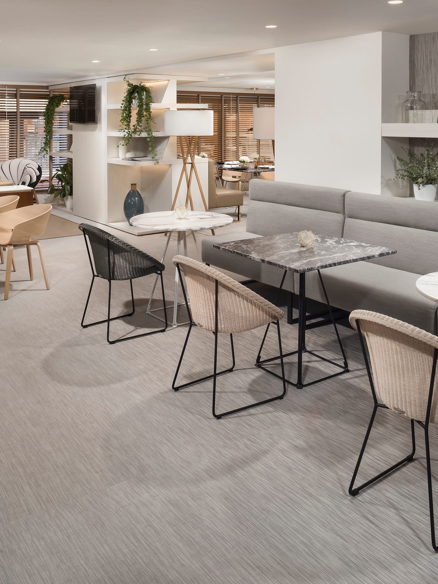 a room with a couch and tables