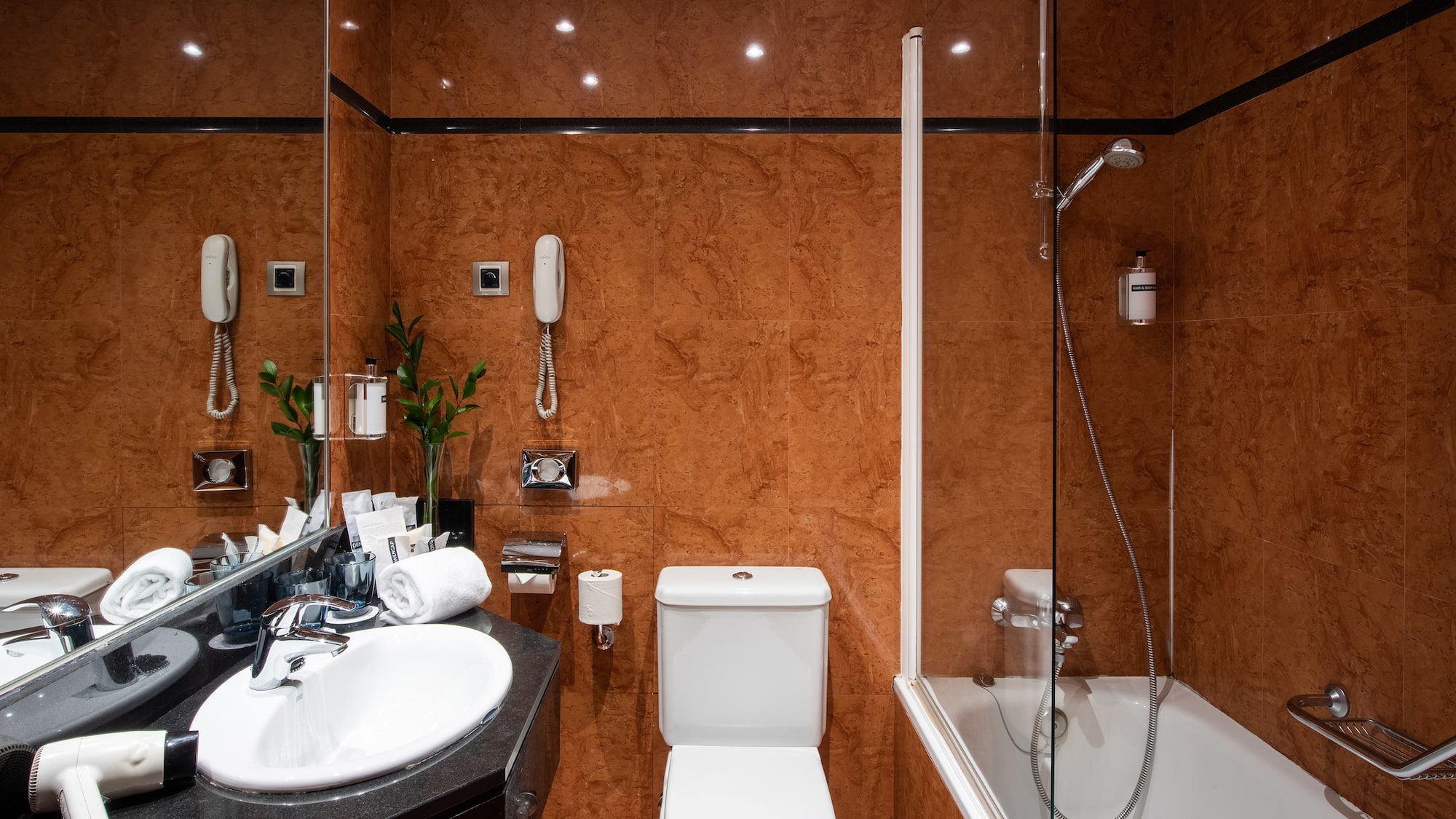 a bathroom with a shower and toilet