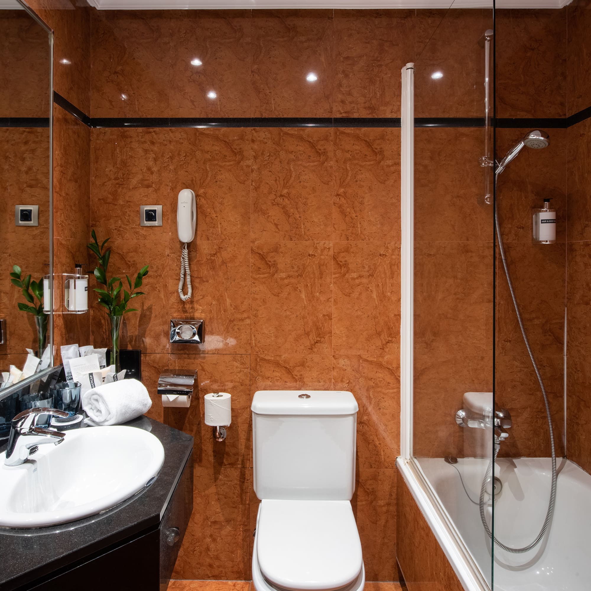 a bathroom with a shower and toilet