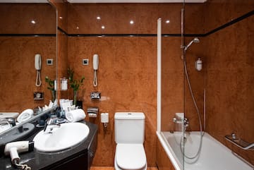 a bathroom with a shower and toilet
