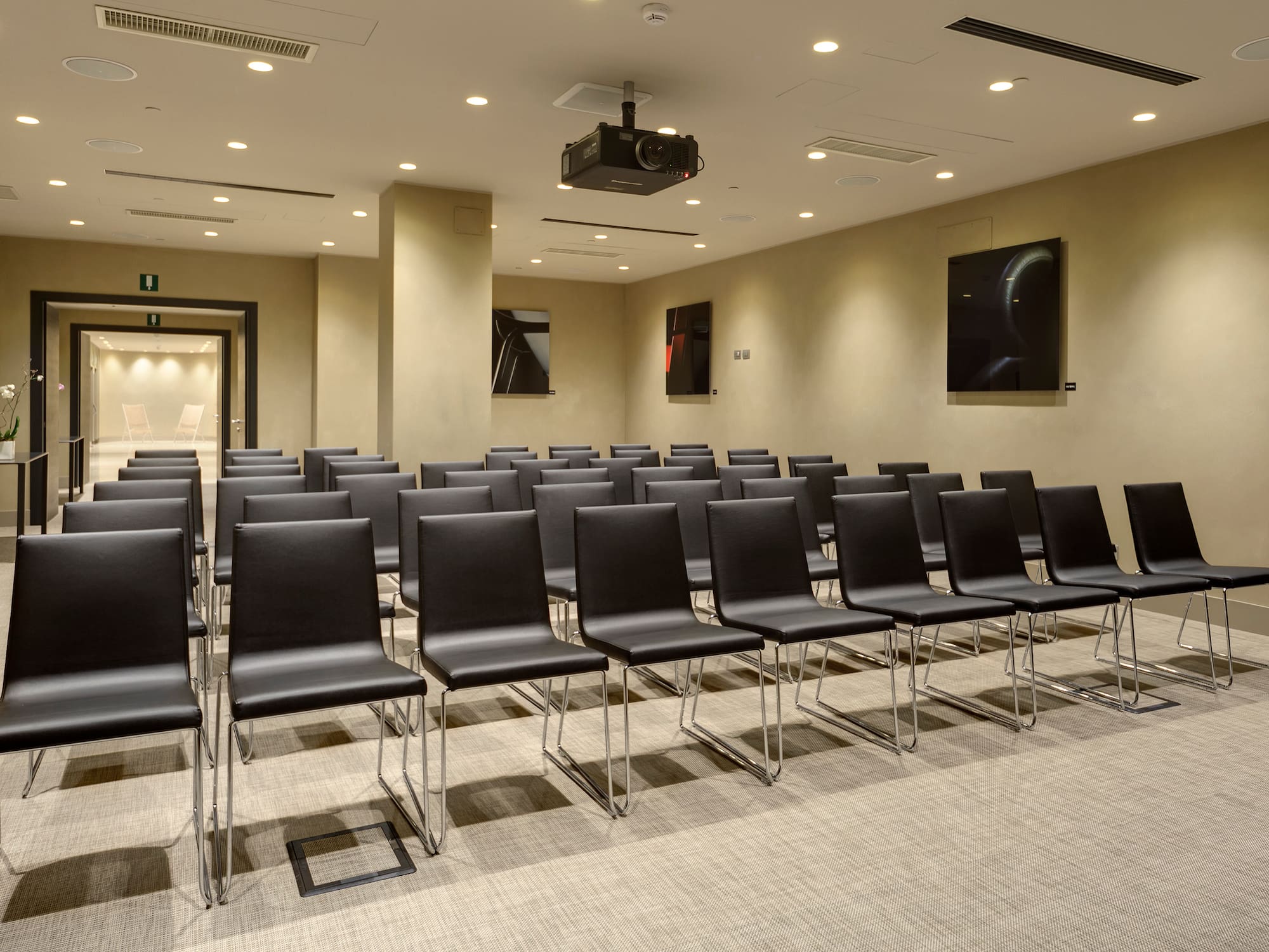a room with rows of chairs