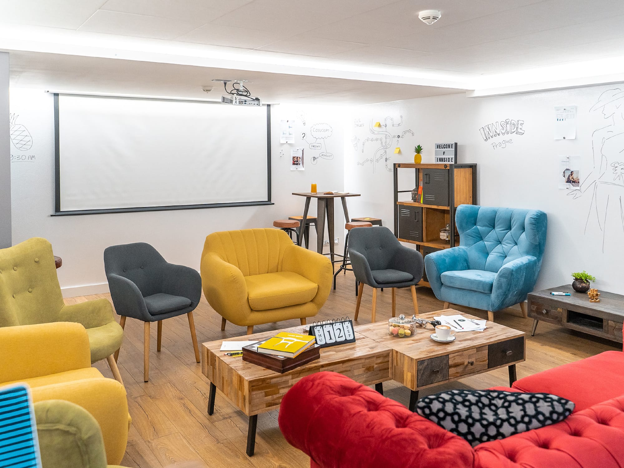 a room with colorful chairs and a table