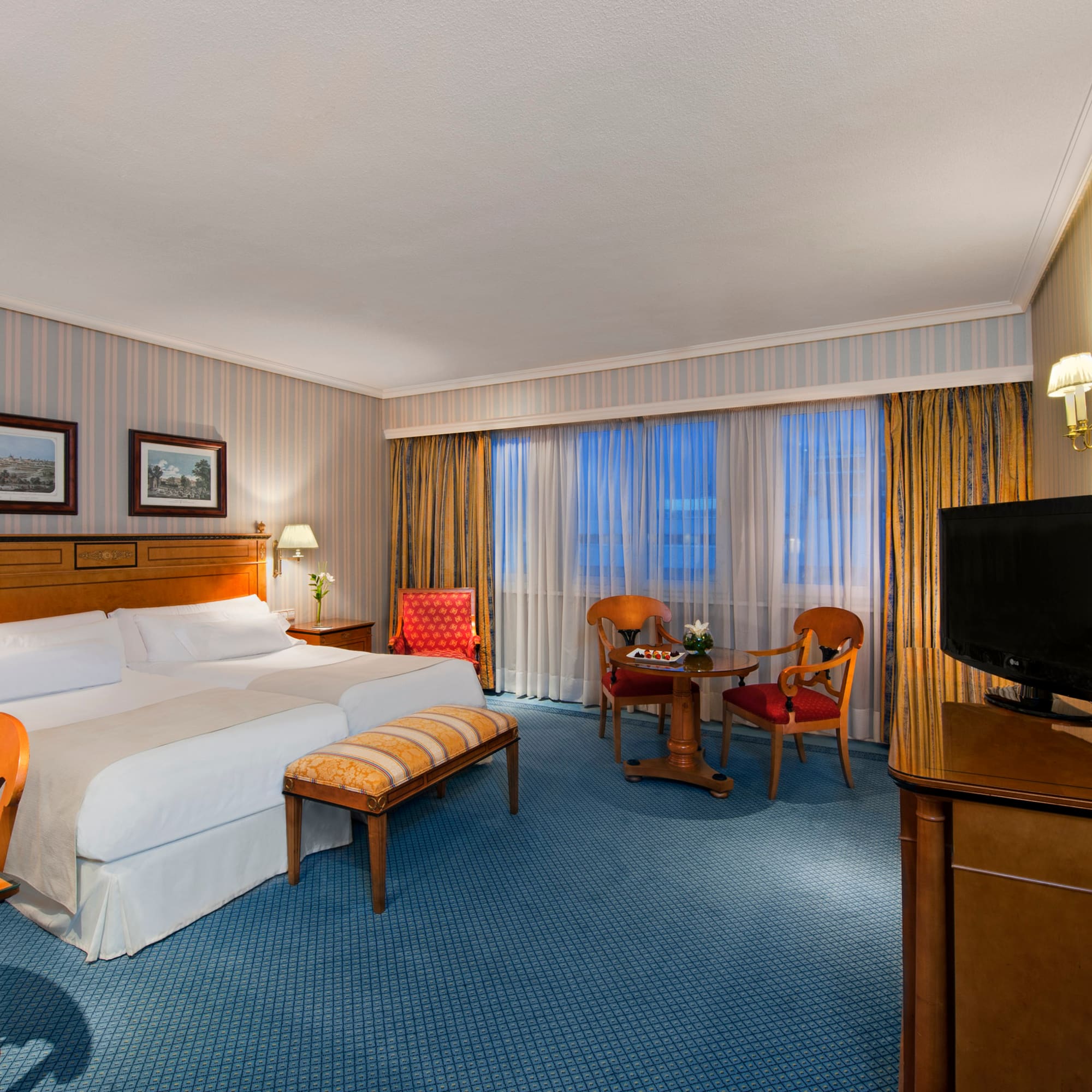 a room with a bed and a television