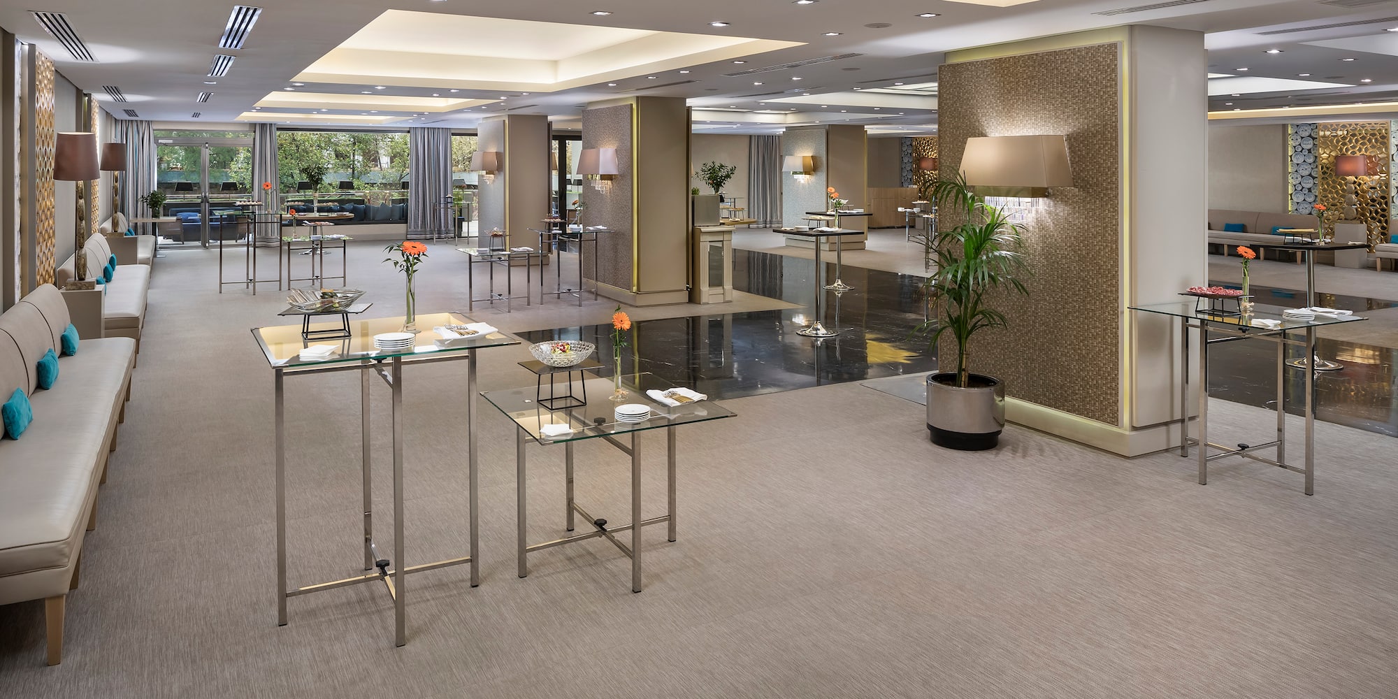 a room with tables and plants