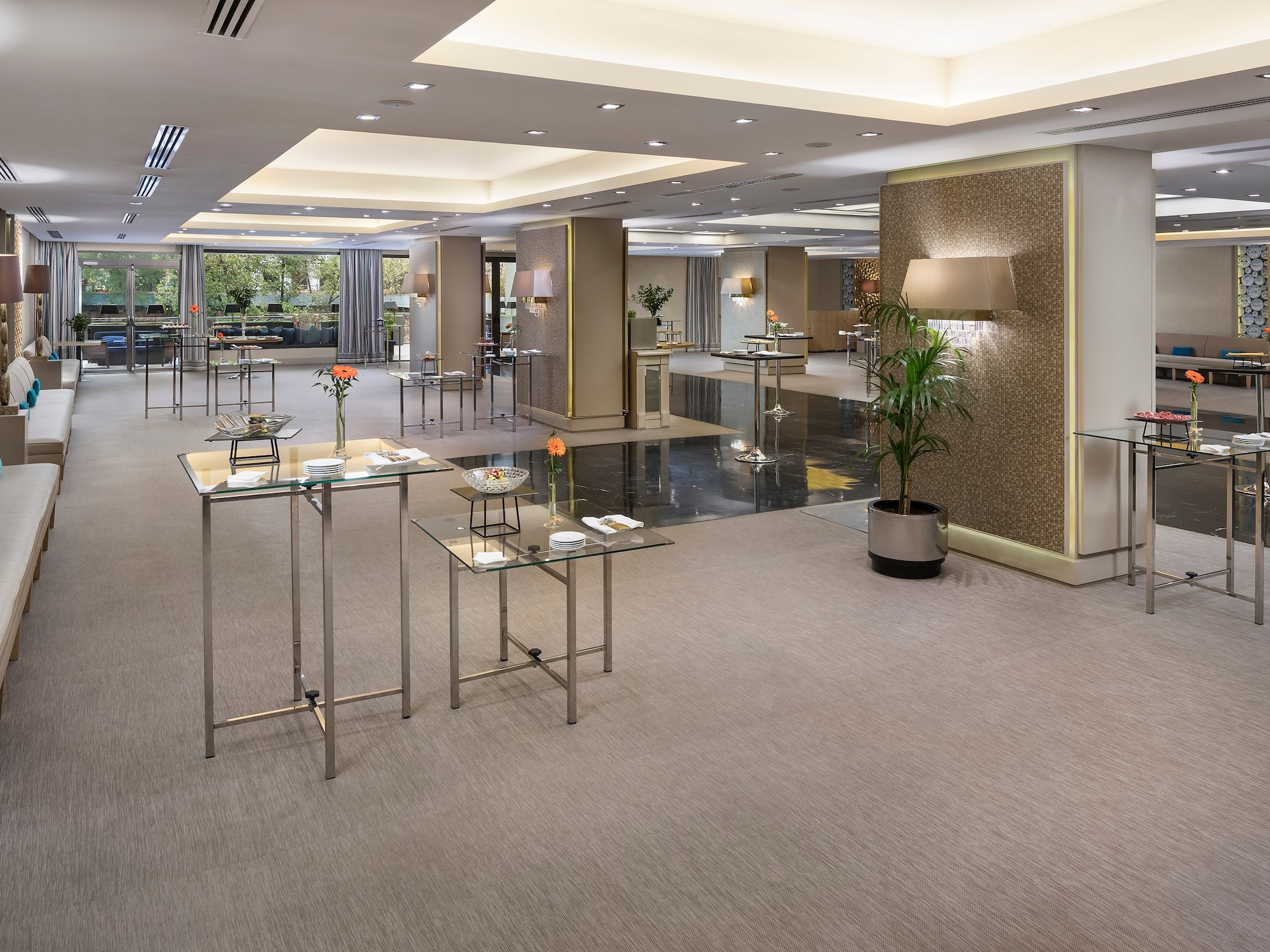 a room with tables and plants