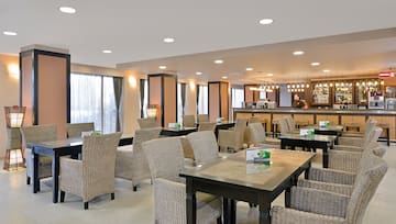 a restaurant with tables and chairs