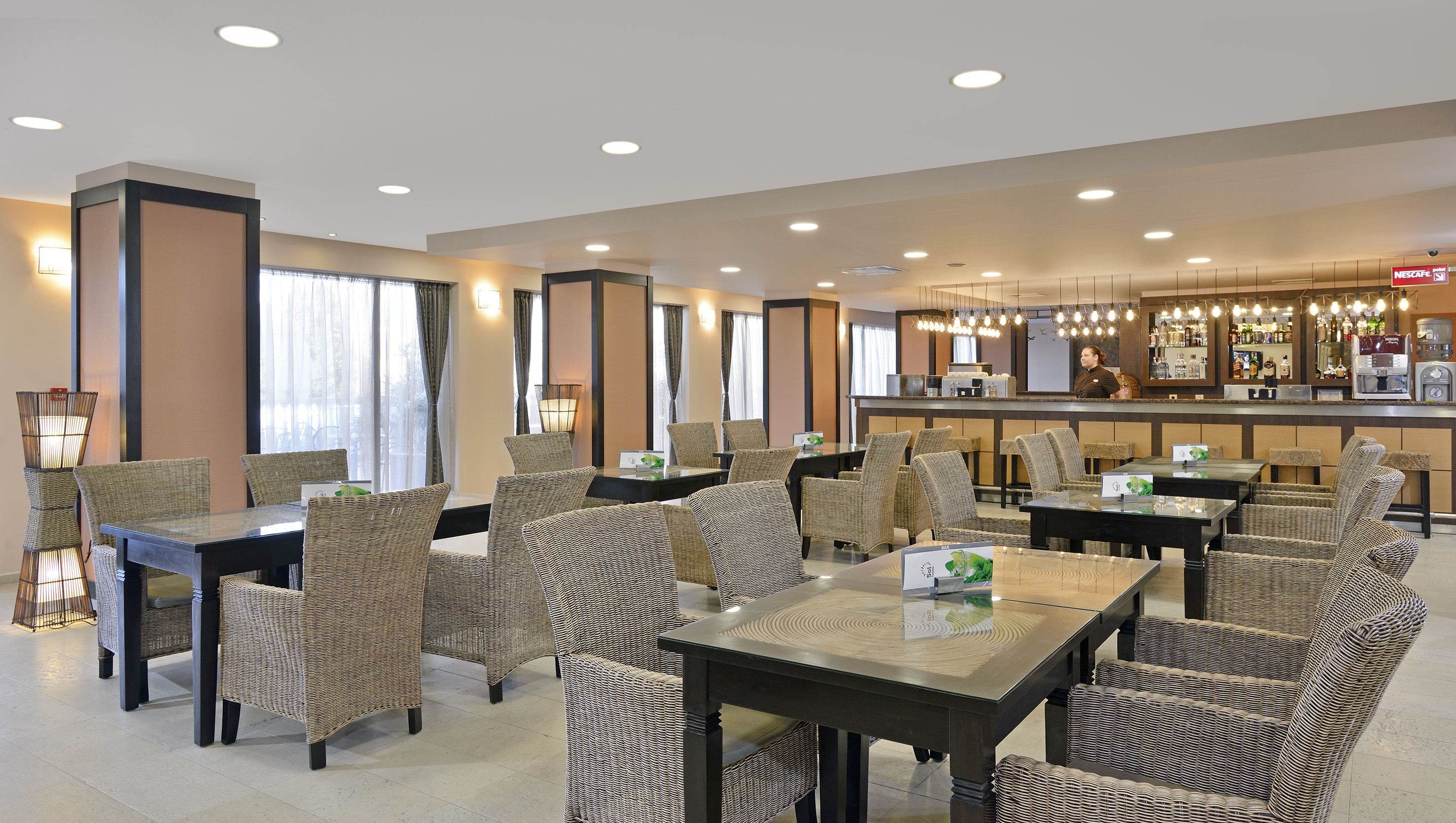 a restaurant with tables and chairs