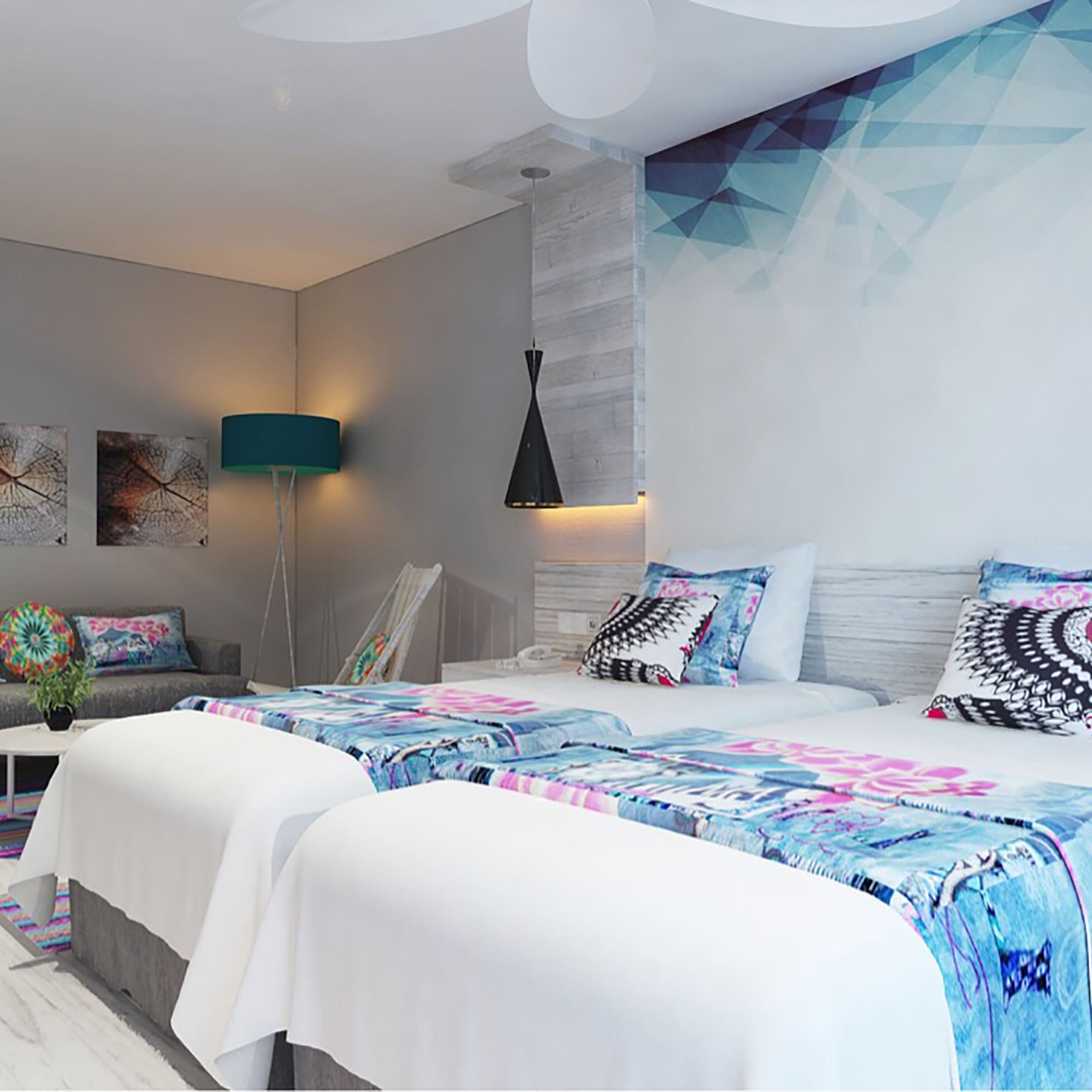 a room with two beds and a lamp