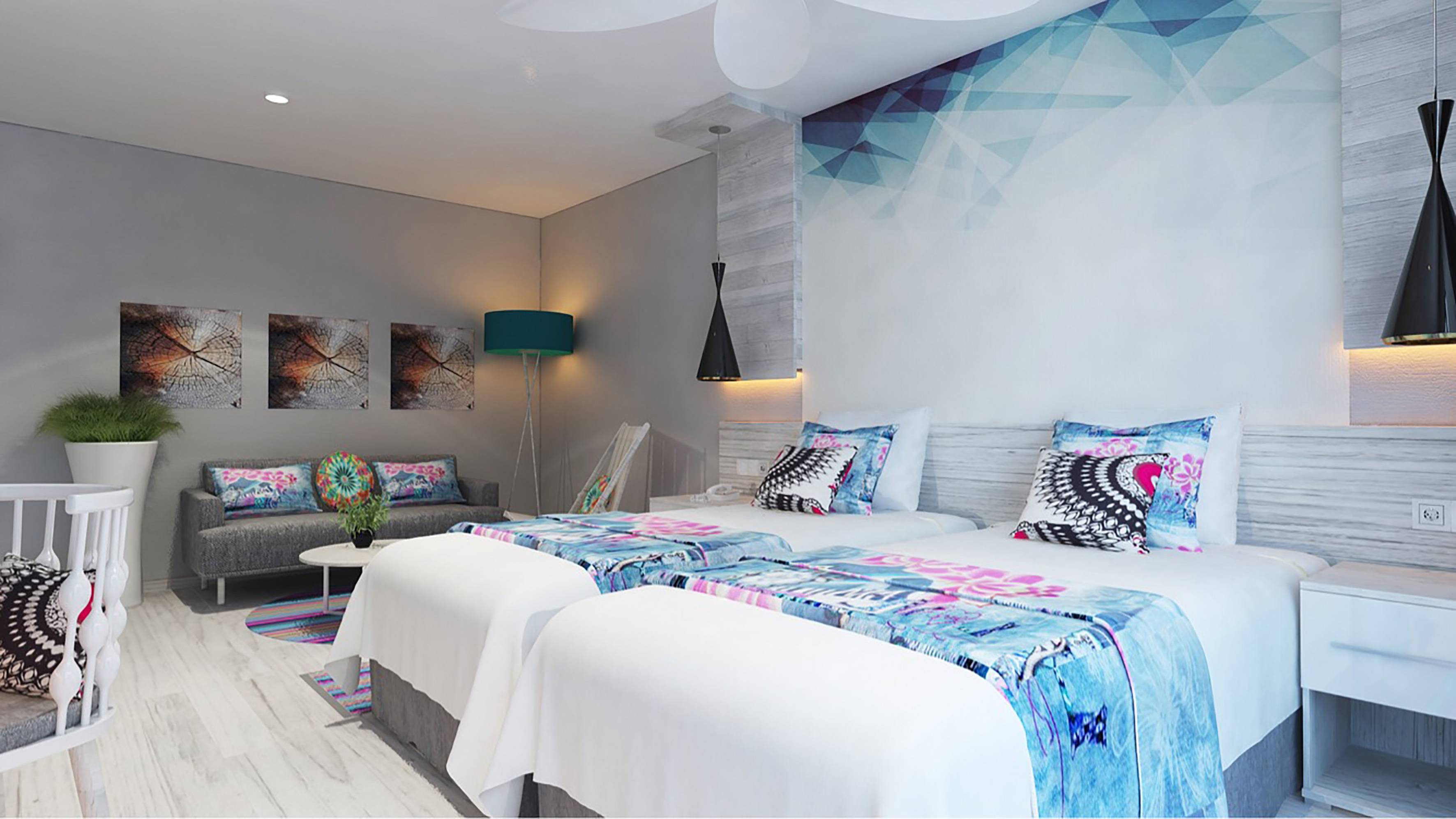 a room with two beds and a lamp