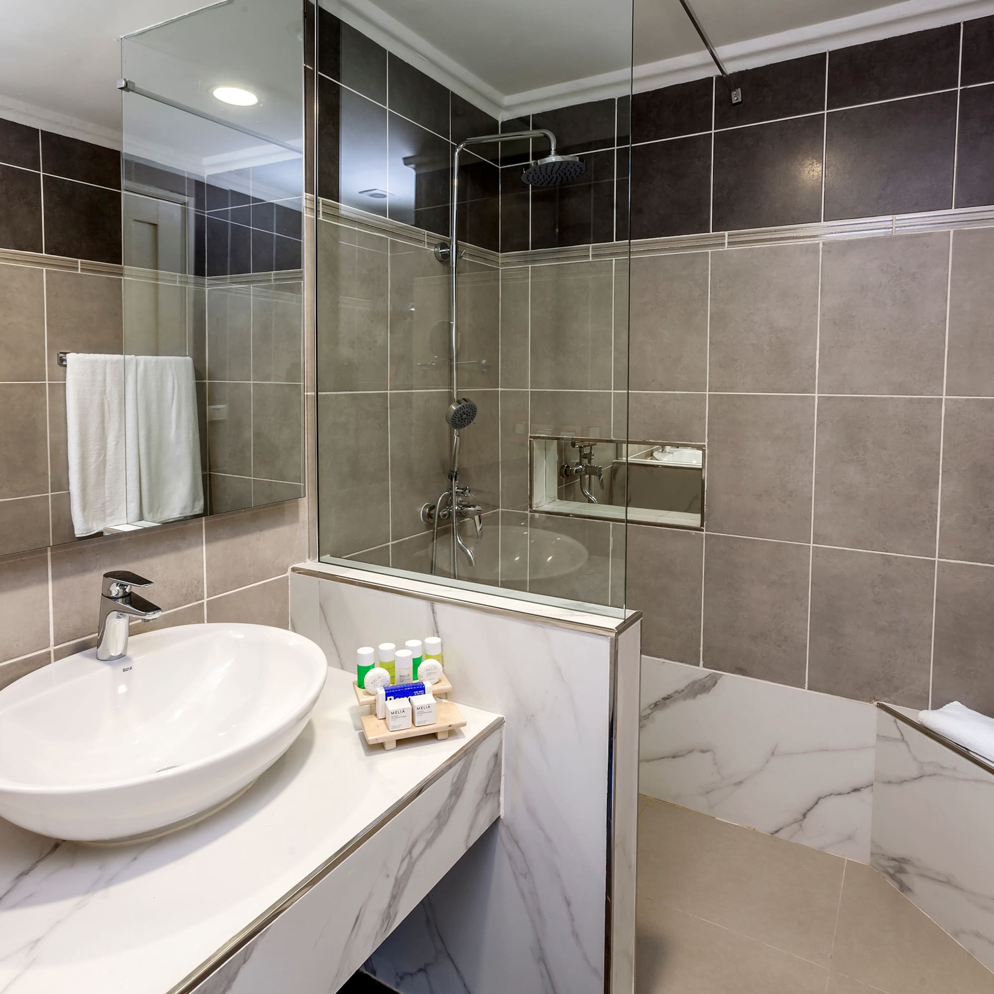a bathroom with a sink and shower