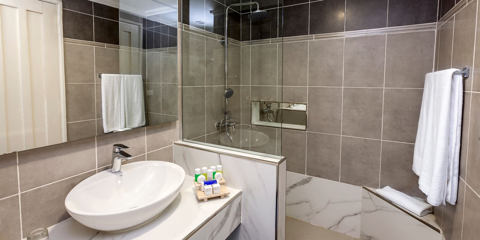 a bathroom with a sink and shower