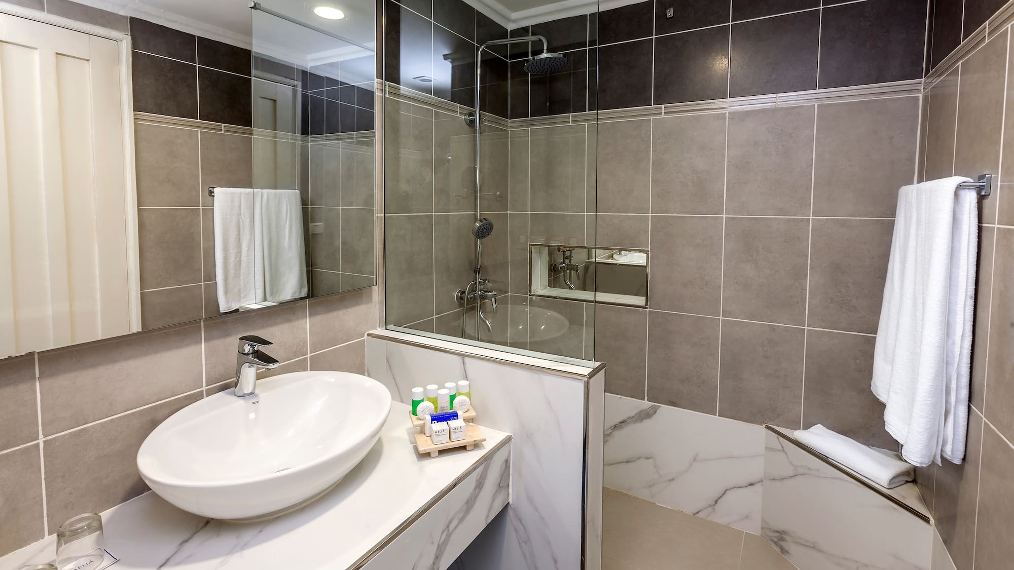 a bathroom with a sink and shower