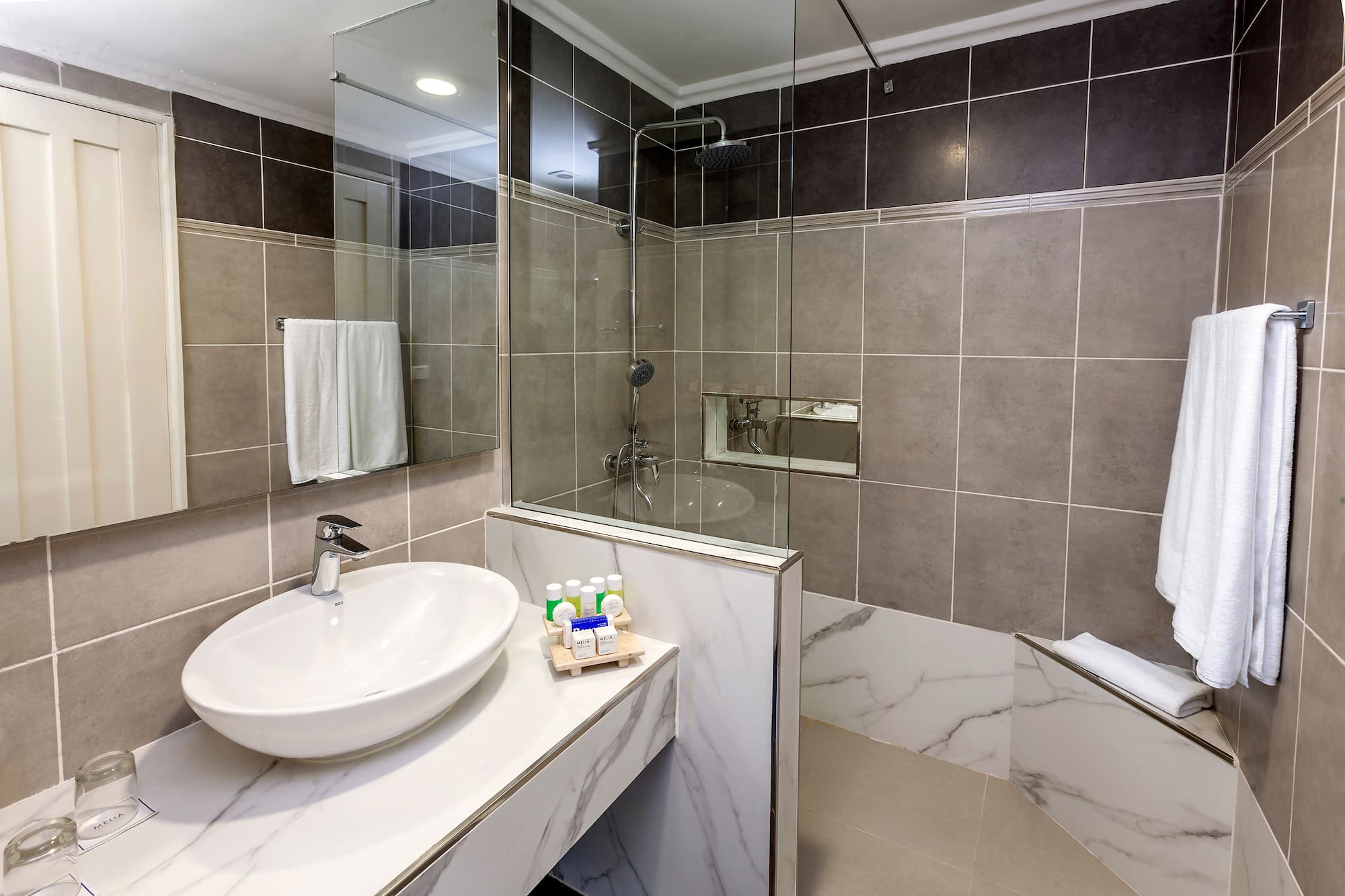 a bathroom with a sink and shower