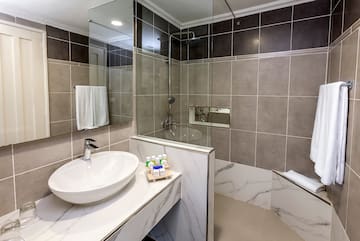 a bathroom with a sink and shower