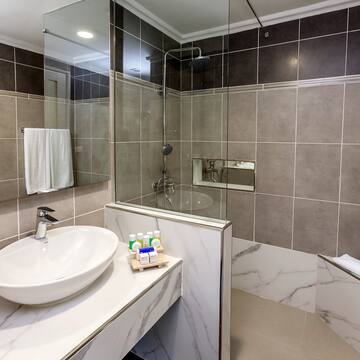 a bathroom with a sink and shower