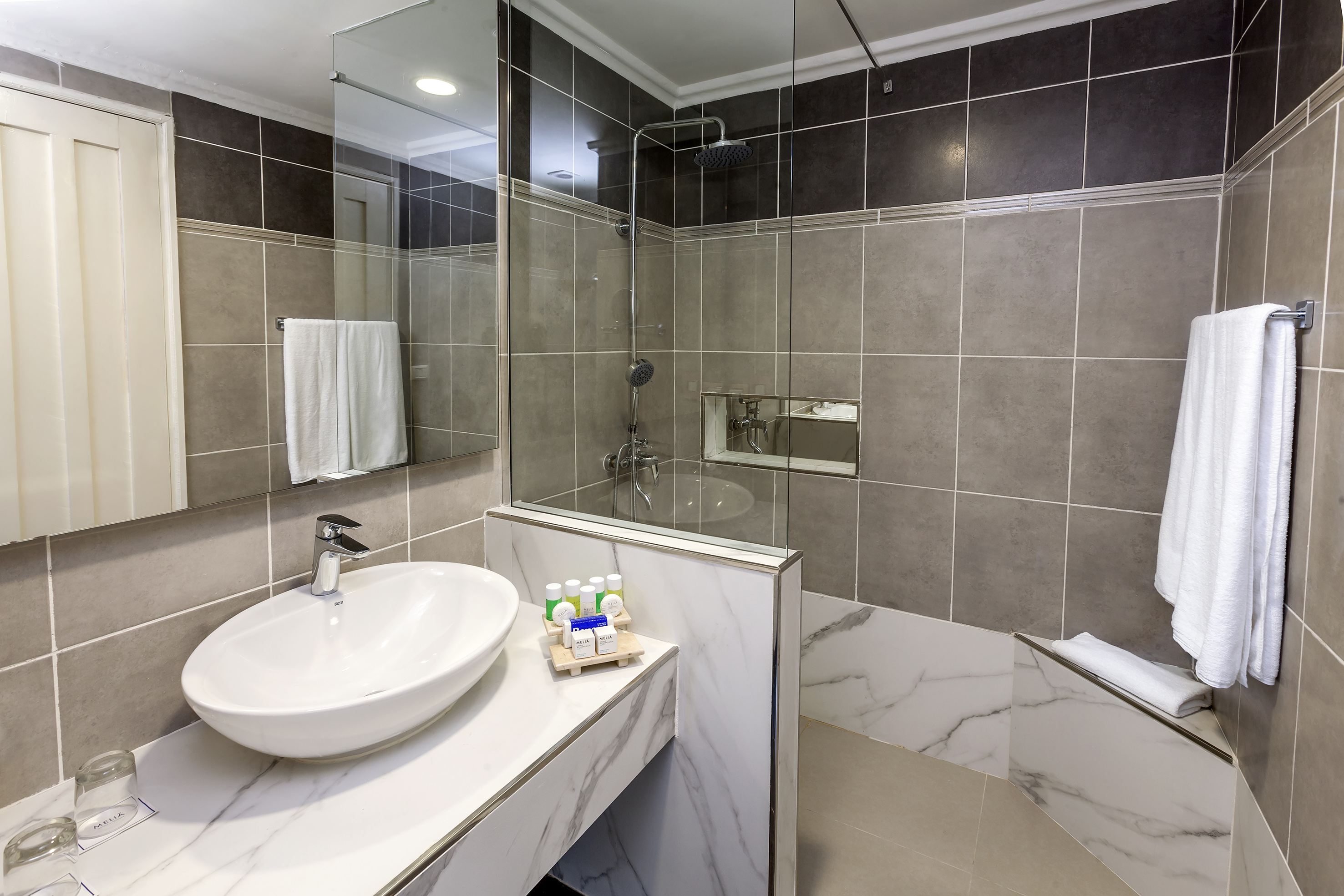 a bathroom with a sink and shower