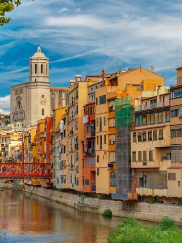 a river with a bridge over a city