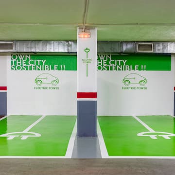 a green and white parking garage