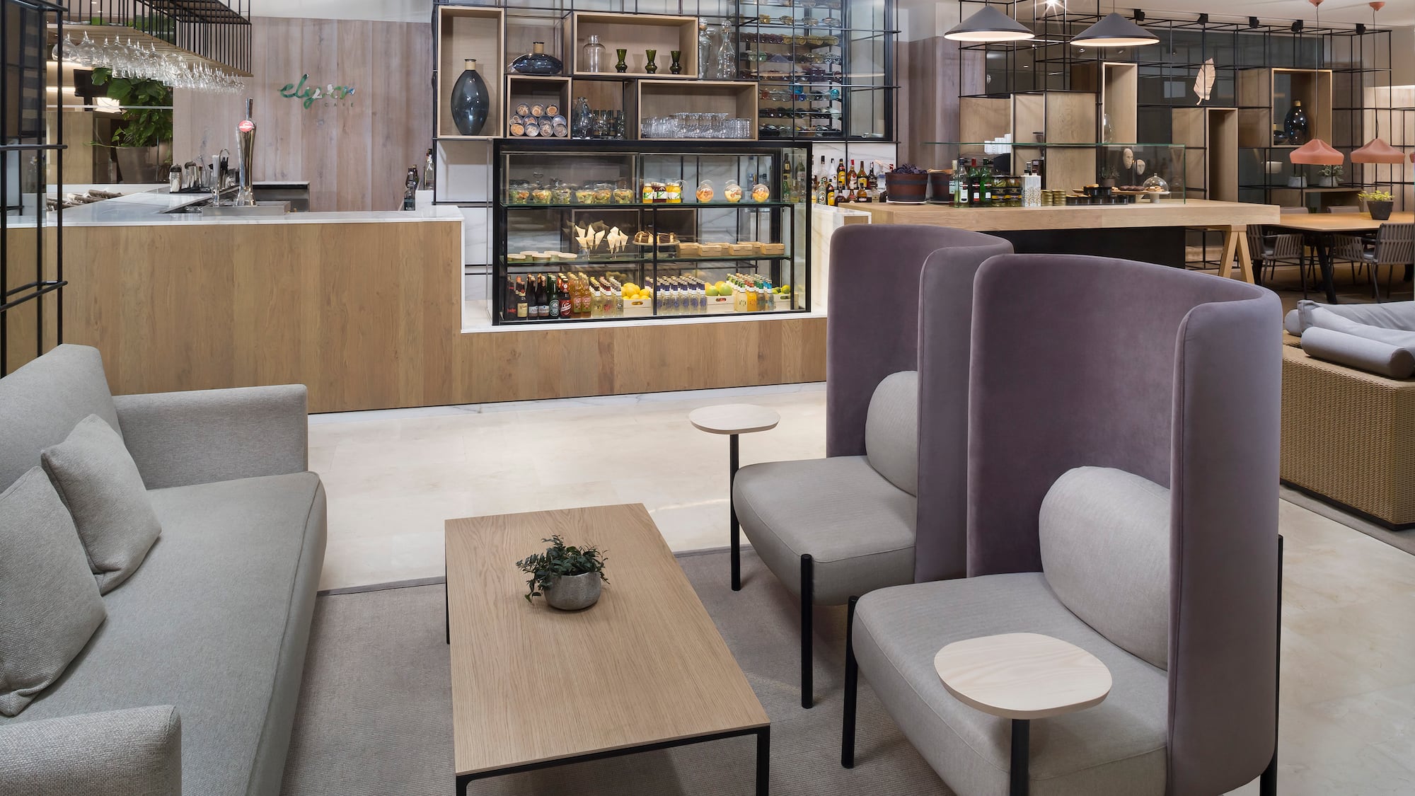 a room with a coffee table and chairs