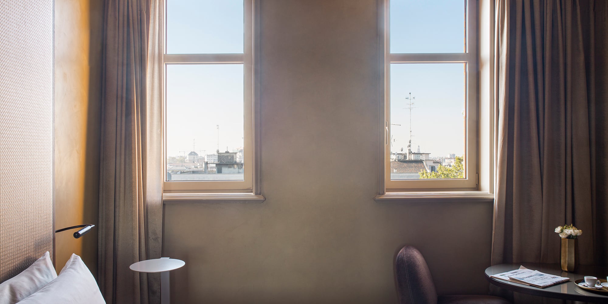 a bedroom with a bed and a table and chairs