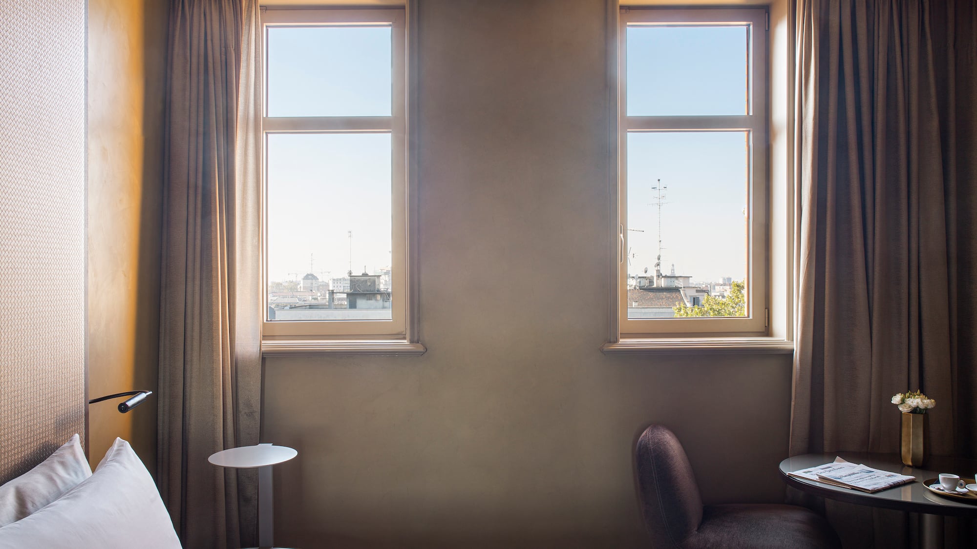 a bedroom with a bed and a table and chairs