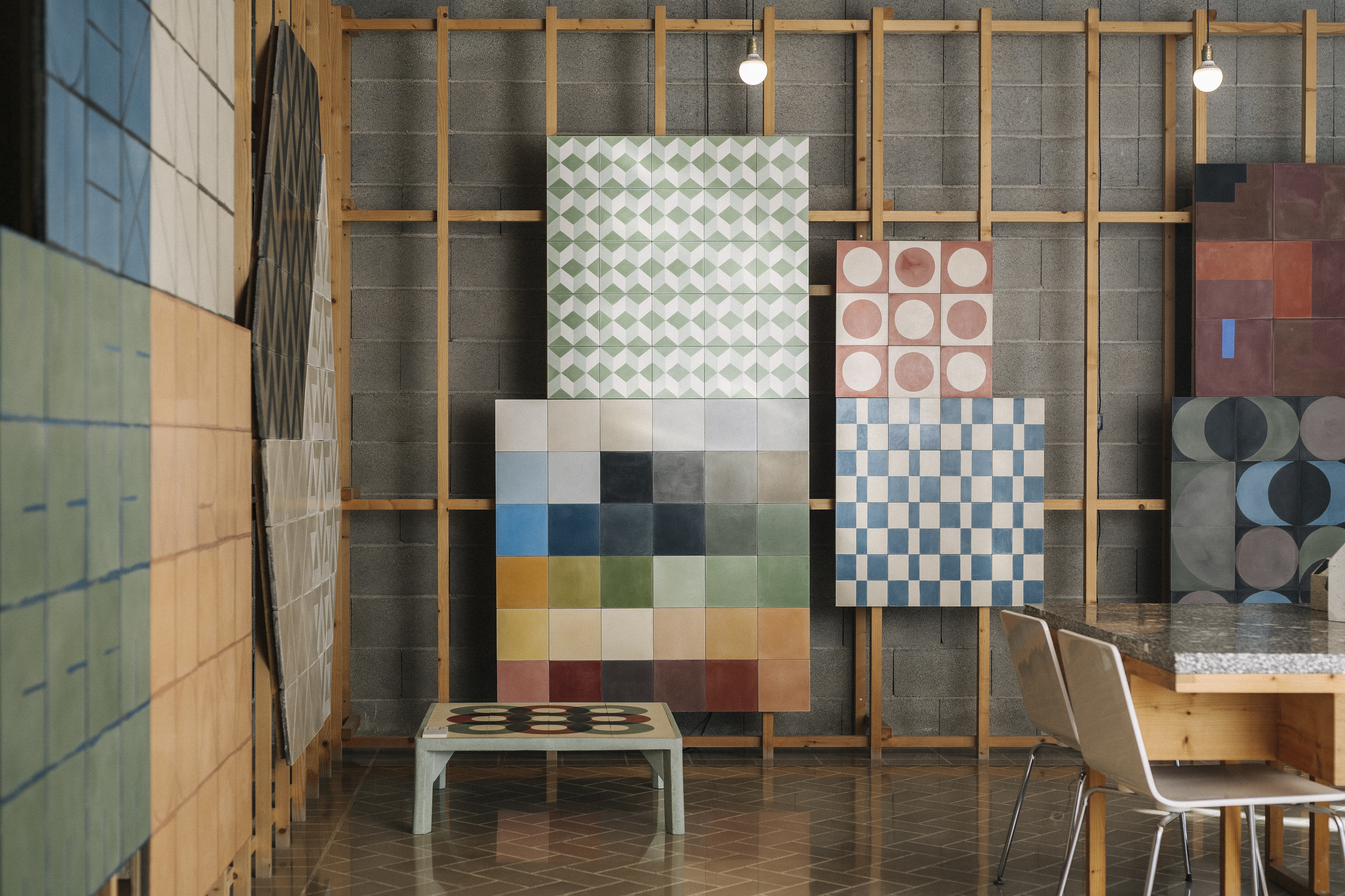 a room with a table and chairs and a board