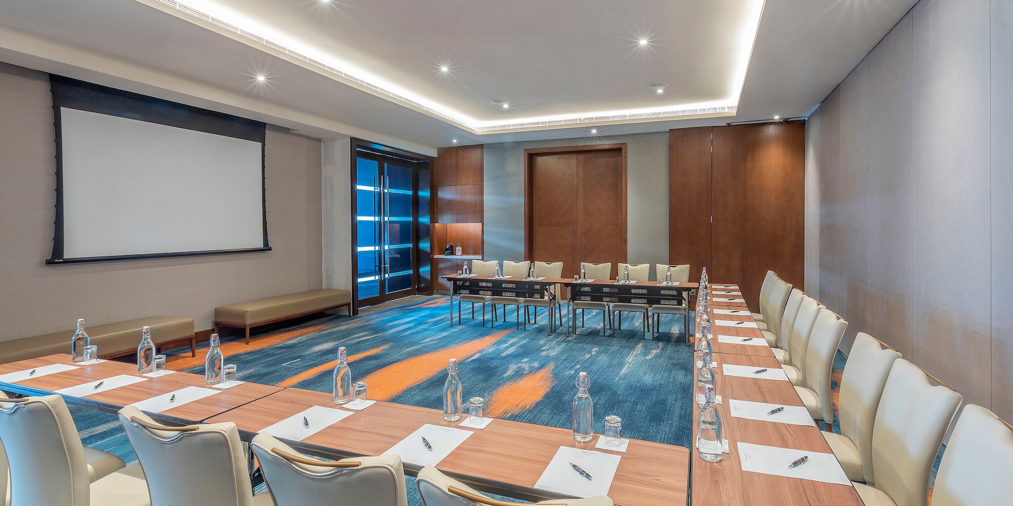 a room with a large table and chairs
