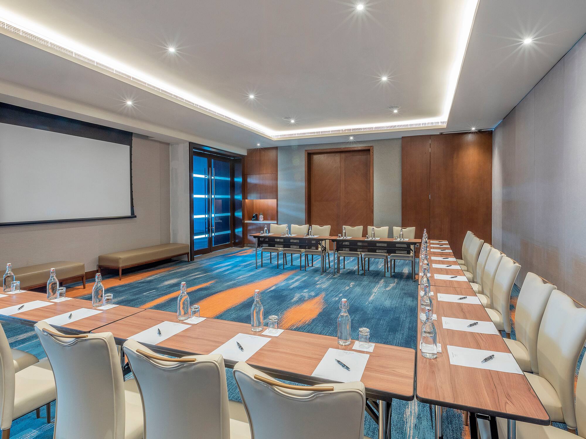 a room with a large table and chairs