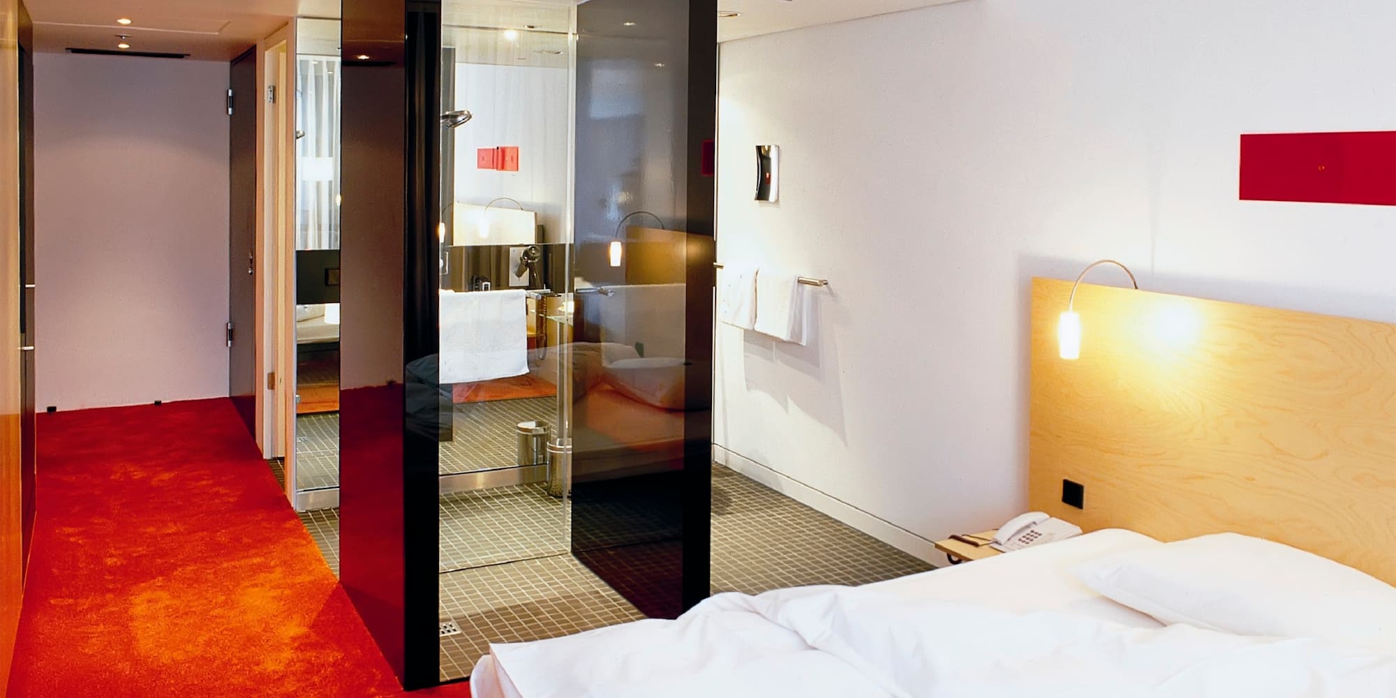 a bedroom with glass doors