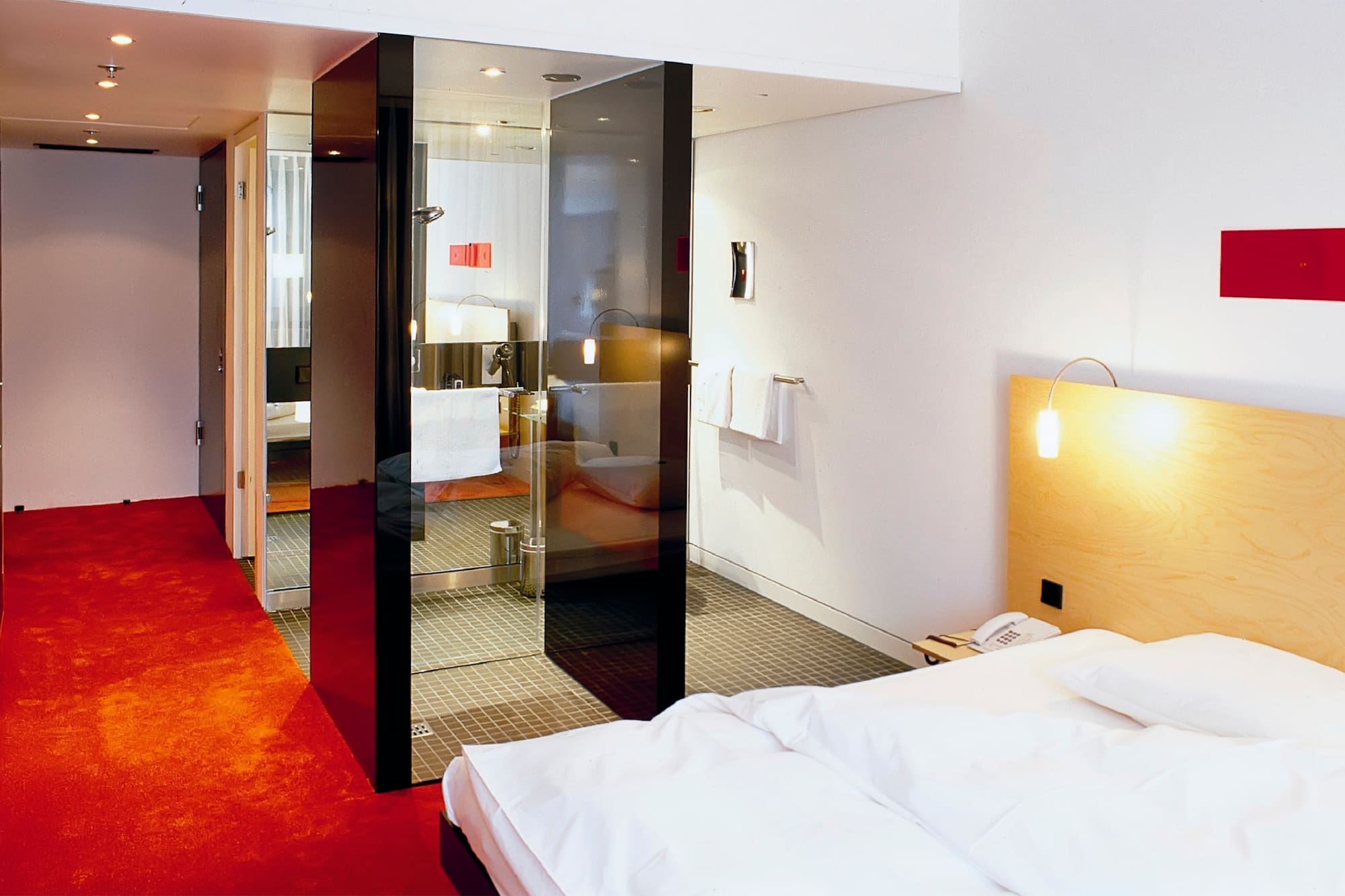 a bedroom with glass doors