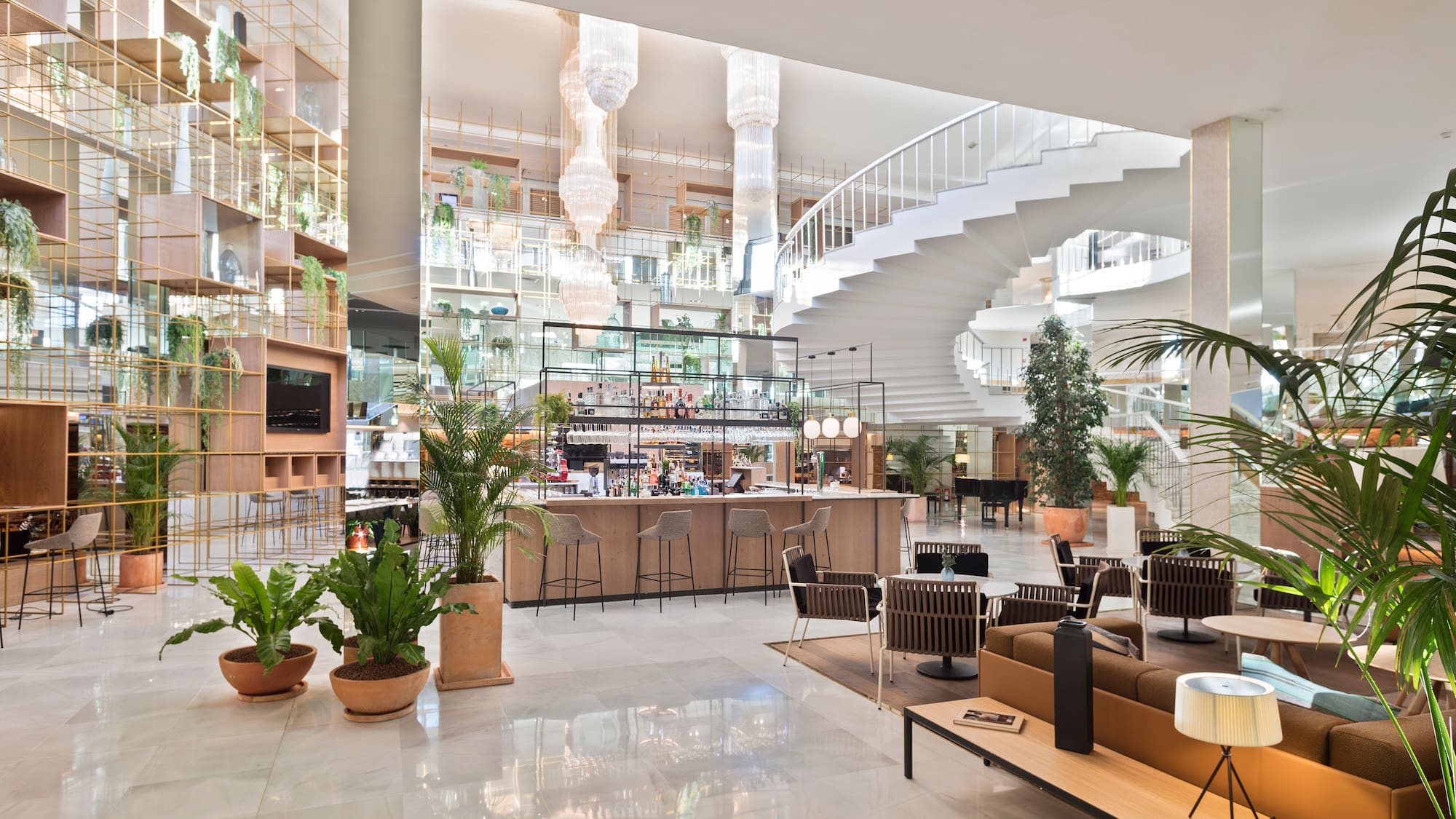 a large building with a staircase and a bar