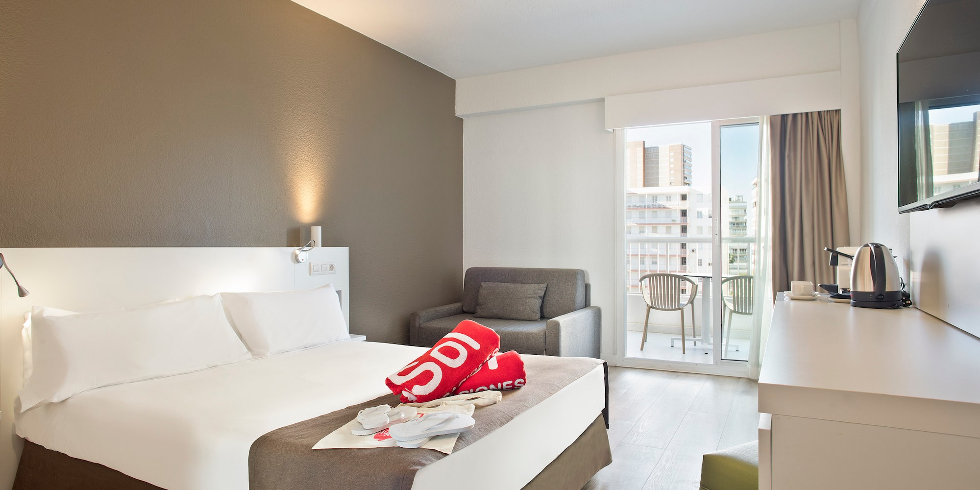 a room with a bed and a chair