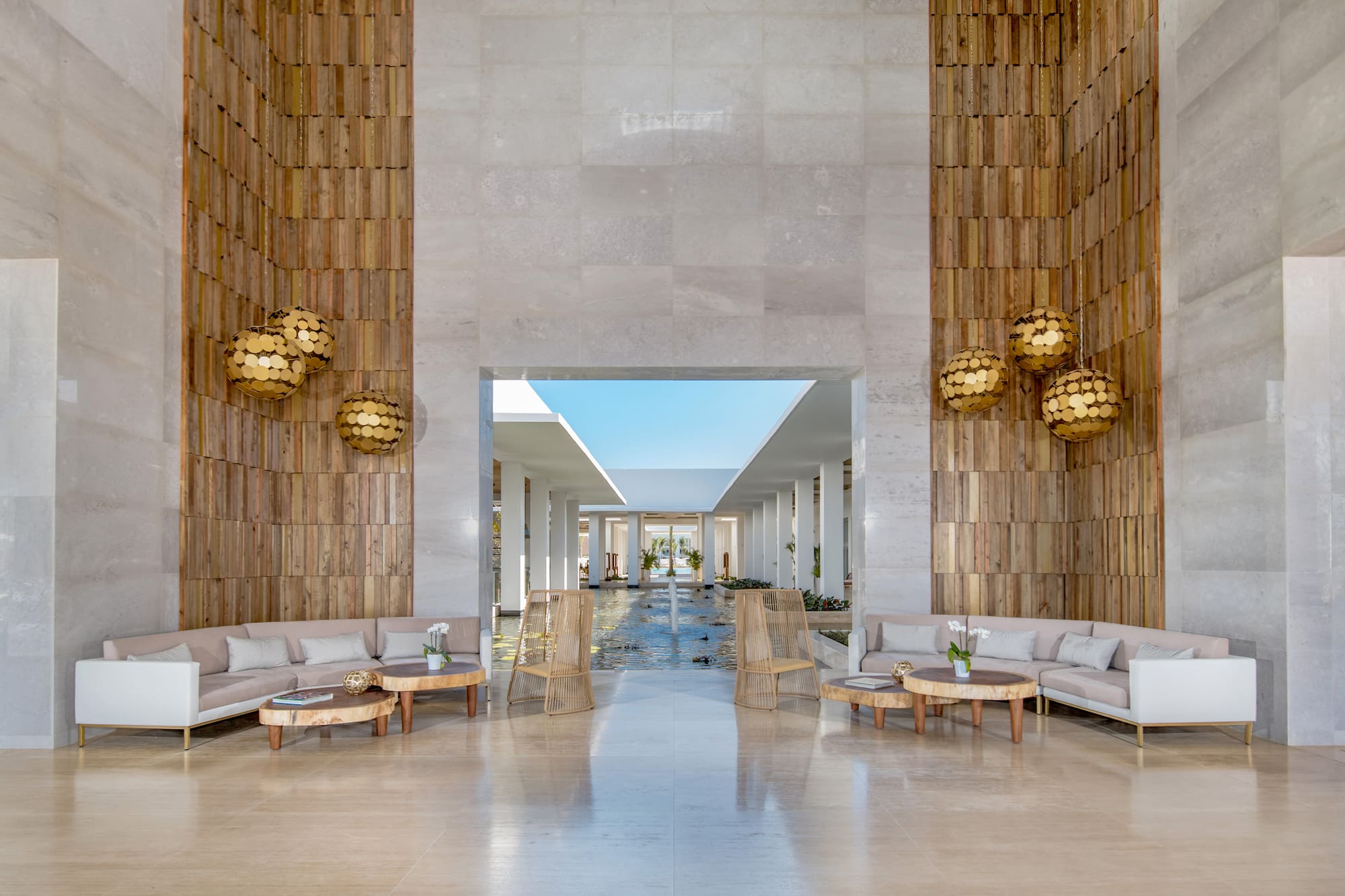 a lobby with a large stone wall and a large stone wall with a large stone wall and a large stone wall with a large stone wall with a large stone wall with a large stone wall with a