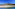 a beach with a mountain in the background