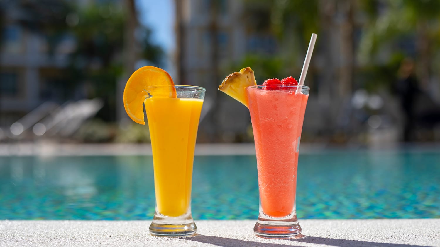 two glasses of juice next to each other