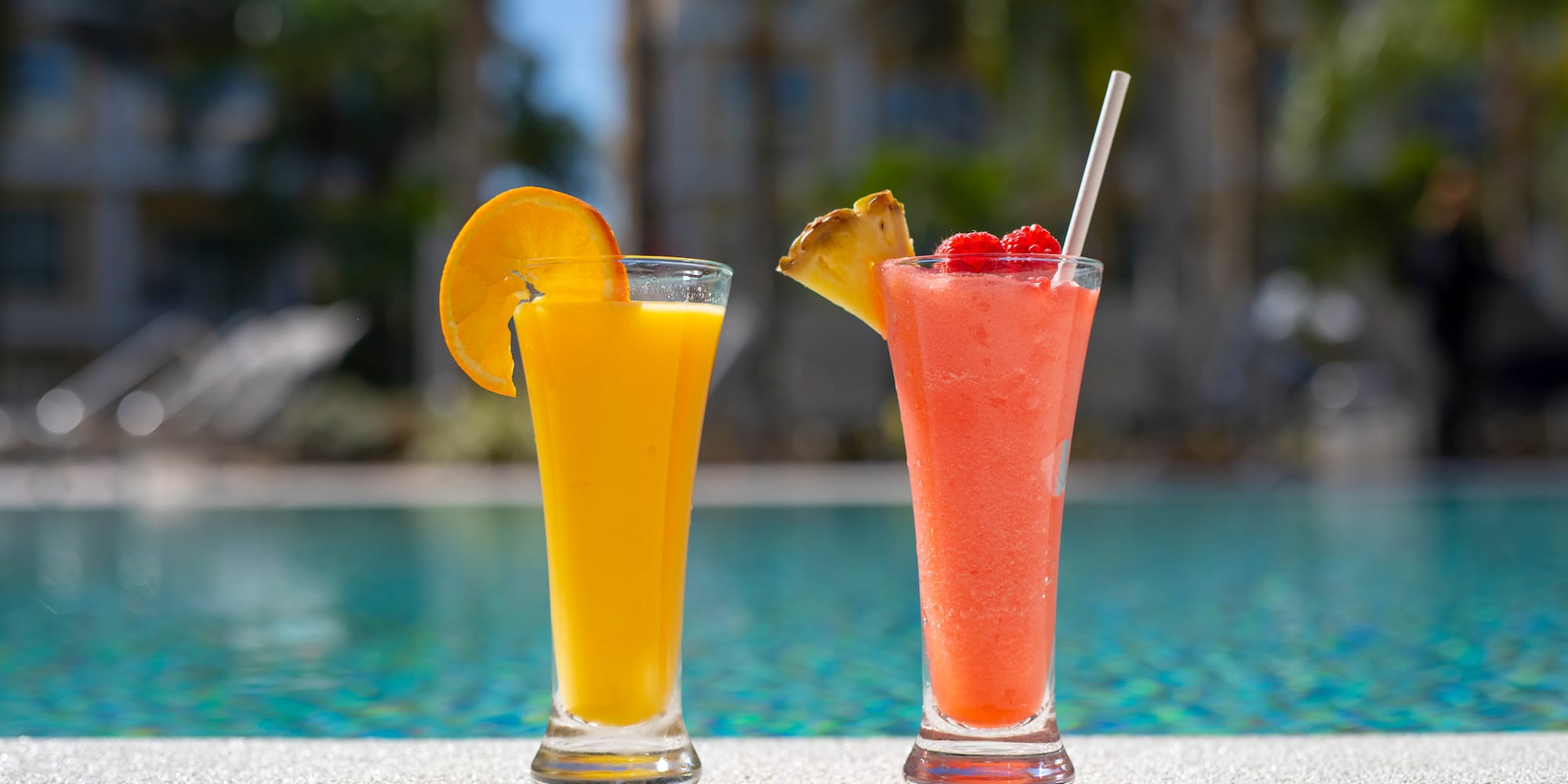 two glasses of juice next to each other