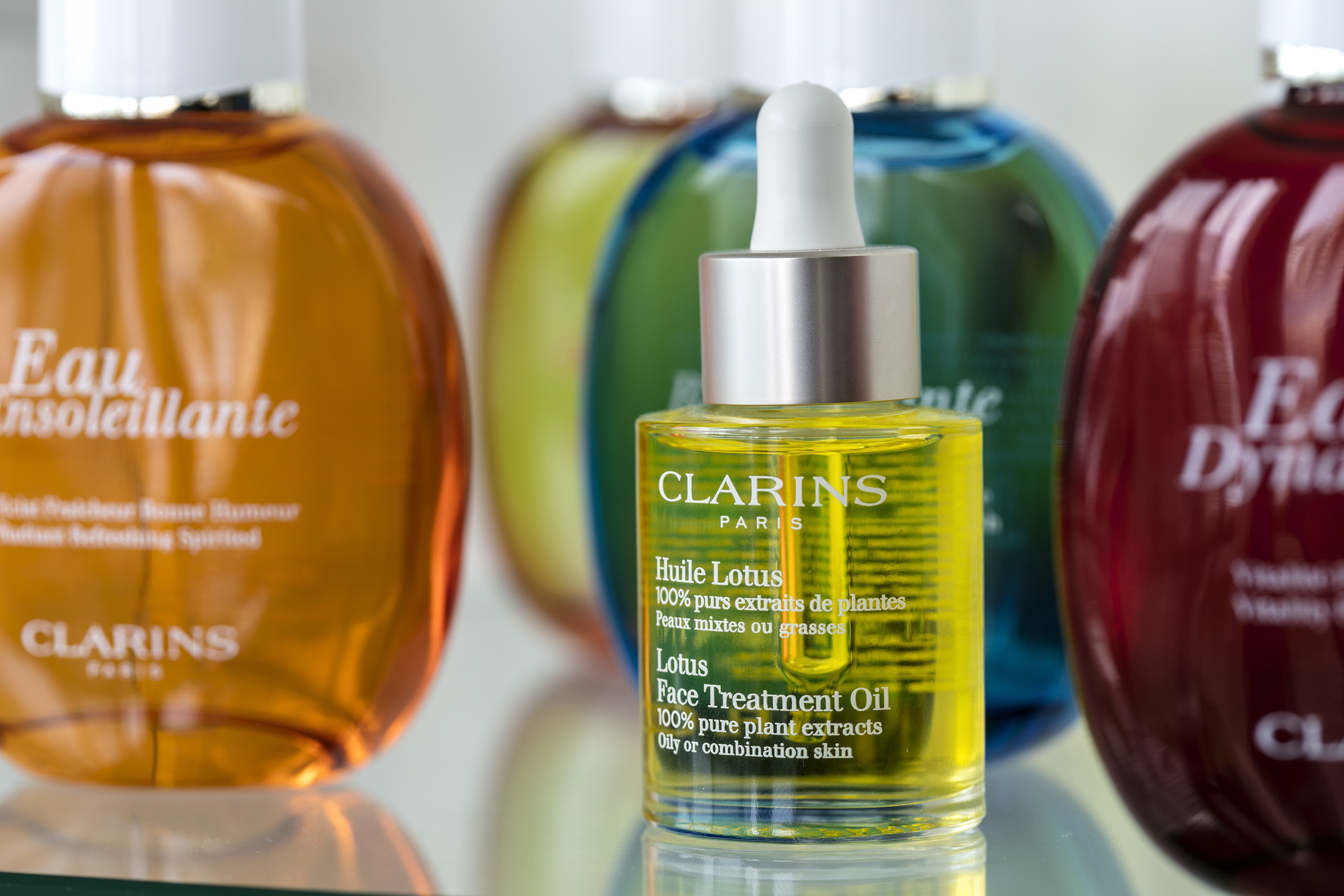 a bottle of oil with a dropper