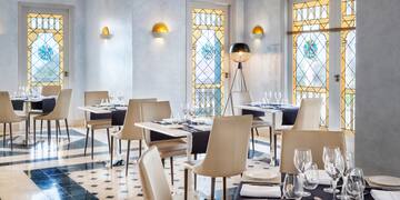 a restaurant with tables and chairs